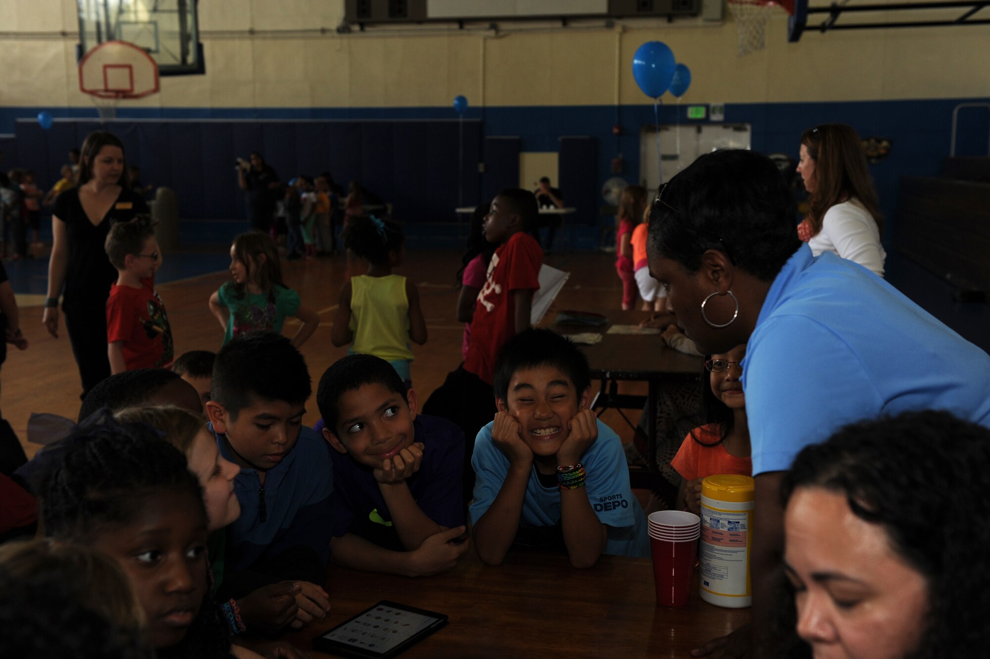 Children with the Himiwari and Shimanoko School Age Programs learn about applications on an iPad and how the apps aid autistic people during the Autism Awareness Fair at the youth center on Kadena Air Base, Japan, April 10, 2014. The purpose of hosting the fair is to spread awareness of autism, what it is or isn’t, and how it affects people. (U.S. Air Force photo by Airman 1st Class Hailey R. Staker)