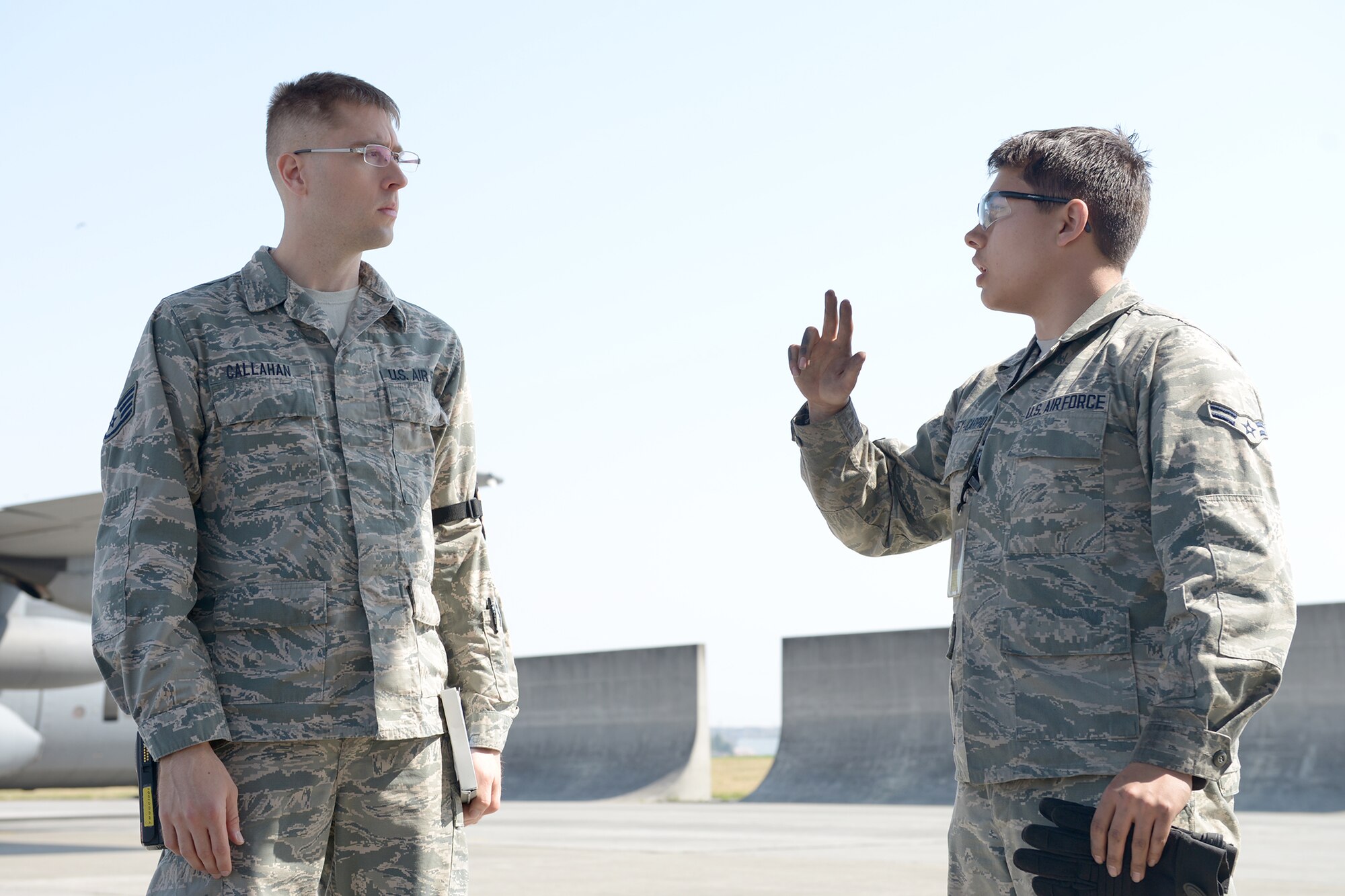 Airman 1st Class Alejandro Megahey-Carpio, 374th Aircraft Maintenance Squadron aerospace maintenance apprentice, answers questions as part of a quality assurance inspection at Yokota Air Base, Japan, April 8, 2014. Aircraft maintainers are regularly tested on their knowledge of safety compliance regulations. (U.S. Air Force photo by Airman 1st Class David Danford/Released)