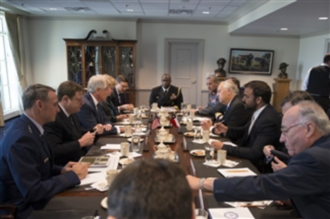 U.S. Defense Secretary Chuck Hagel, third from left, and Chilean Defense MInister Jorge Burgos, fourth from right, meet at the Pentagon, April 16, 2014. The two leaders discussed issues of mutual importance. 