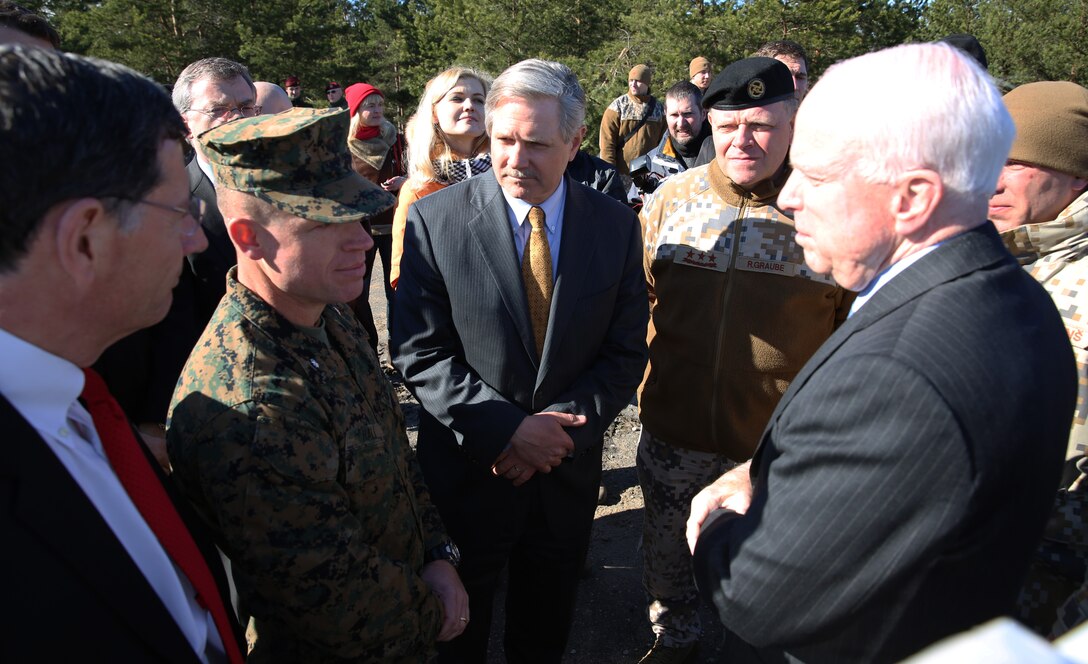 U.S. Marine Lt. Col. Trevor Hall, the battalion commander of 3rd Battalion, 8th Marine Regiment and Black Sea Rotational Force 14.2, speaks with Senators John McCain (R-AZ), John Hoeven (R-ND), and John Barrasso (R-WY) about exercise Summer Shield and the importance of interoperability between U.S., Latvian, Estonian and Lithuanian service members at a range near Camp Adazi, Latvia, April 15, 2014. This is the 11th iteration of the Summer Shield exercise, a joint staff planning and live-fire maneuver event designed to enhance the NATO force’s capacity and capability to integrate combined arms and maneuver at the battalion and brigade level. It also increases partner capacity, promotes regional stability, and enhances Latvian, Lithuanian, Estonian, and U.S. interoperability as NATO allies. (Official Marine Corps photo by Lance Cpl. Scott W. Whiting, BSRF PAO/ Released)