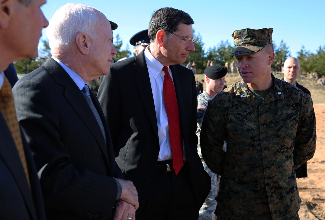 (Right to left) Lt. Col. Trevor Hall, the battalion commander of 3rd Battalion, 8th Marine Regiment and Black Sea Rotational Force 14.2, speaks with Senators John Barrasso (R-WY), John McCain (R-AZ), and John Hoeven (R-ND) during a live-fire exercise involving U.S., Latvian and Estonian service members during exercise Summer Shield at a range near Camp Adazi, Latvia, April 15, 2014. This is the 11th iteration of the Summer Shield exercise, a joint staff planning and live-fire maneuver event designed to enhance the NATO force’s capacity and capability to integrate combined arms and maneuver at the battalion and brigade level. It also increases partner capacity, promotes regional stability, and enhances Latvian, Lithuanian, Estonian, and U.S. interoperability as NATO allies. (Official Marine Corps photo by Lance Cpl. Scott W. Whiting, BSRF PAO/ Released)