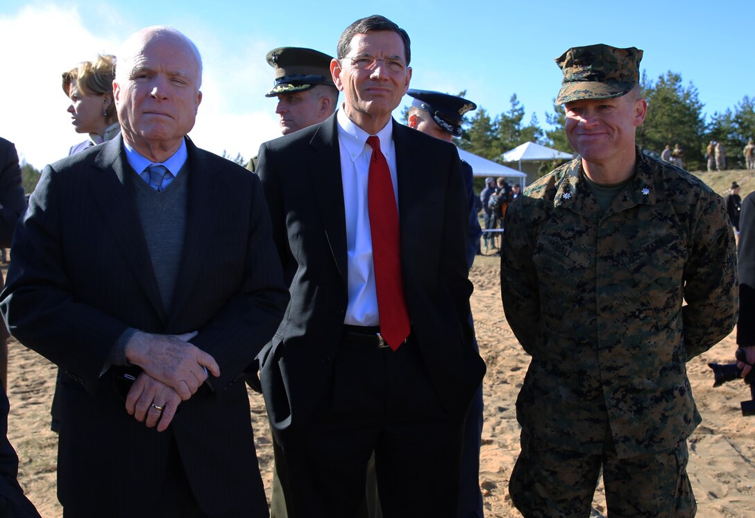 U.S. Senators John McCain (R-AZ) and John Barrasso (R-WY), and Lt. Col. Trevor Hall, the battalion commander of 3rd Battalion, 8th Marine Regiment, and Black Sea rotational Force 14.2, wait as Marines prepare to fire a Javelin missile during a live-fire exercise involving U.S., Latvian and Estonian service members at a range near Camp Adazi, Latvia, April 15, 2014. This is the 11th iteration of the Summer Shield exercise, a joint staff planning live-fire maneuver event designed to enhance the NATO force’s capacity and capability to integrate combined arms and maneuver at the battalion and brigade level. It also increases partner capacity, promotes regional stability, and enhances Latvian, Lithuanian, Estonian, and U.S. interoperability as NATO allies. (Official Marine Corps photo by Lance Cpl. Scott W. Whiting, BSRF PAO/ Released)