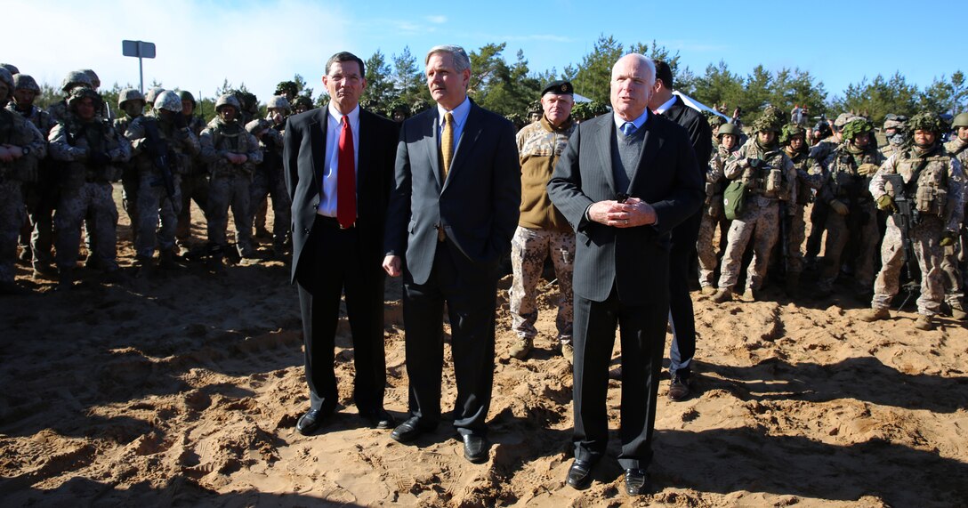 (Left to right) U.S. Senators John Barrasso (R-WY), John Hoeven (R-ND) and John McCain (R-AZ) address U.S., Latvian and Estonian service members during their visit to exercise Summer Shield at a range near Camp Adazi, Latvia, April 15, 2014. U.S. Marines with 3rd Battalion, 8th Marine Regiment, 2nd Marine Division assigned to Black Sea Rotational Force 14.2 are participating in Summer Shield in Latvia. This is the 11th iteration of the Summer Shield exercise, a joint staff planning live-fire maneuver event designed to enhance the NATO force’s capacity and capability to integrate combined arms and maneuver at the battalion and brigade level. It also increases partner capacity, promotes regional stability, and enhances Latvian, Lithuanian, Estonian, and U.S. interoperability as NATO allies. (Official Marine Corps photo by Lance Cpl. Scott W. Whiting, BSRF PAO/ Released)