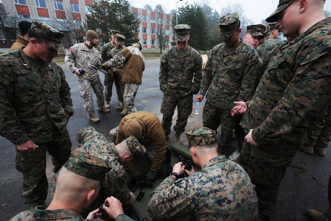 Marines from Weapon’s Company, 3rd Battalion, 8th Marines examine a Latvian 84mm Carl-Gustaf anti-tank recoilless rifle at weapon’s display during Summer Shield aboard Camp Adazi, Latvia, 7 April, 2014.  This is the 11th iteration of the Summer Shield exercise, a joint staff planning and combined arms live fire maneuver event designed to enhance the Latvian Land Force’s capacity and capability to integrate fires and maneuver at the battalion and brigade level as well as increase partner capacity, promote regional stability and to continue to develop Latvian, Lithuanian, Estonian and U.S. interoperability.  (Official Marine Corps photo by Staff Sgt. Tanner M. Iskra, 2nd Marine Division, BSRF, Combat Camera/Released)