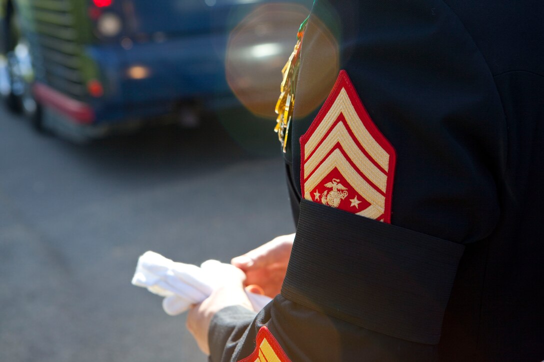Sgt. Maj. Micheal P. Barrett, the 17th Sergeant Major of the Marine Corps, wears a mourning band during a memorial ceremony for retired Gen. Carl E. Mundy Jr., the 30th Commandant of the Marine Corps, at the Marine Corps War Memorial in Arlington, Va., on April 12, 2014. (U.S. Marine Corps photo by Sgt. Marionne T. Mangrum)