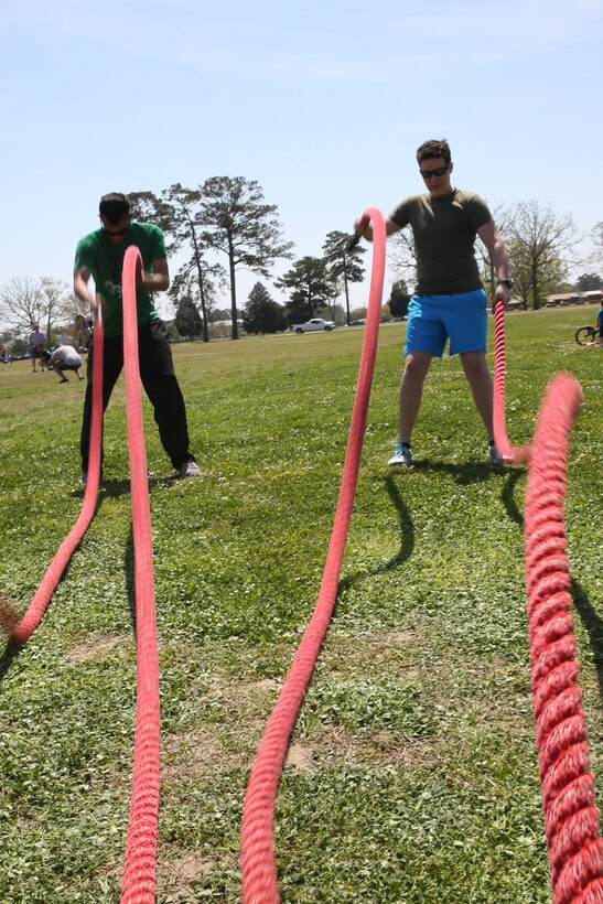 Participants in Marine Air Control Squadron 2’s first HITT for Heroes event perform alternating rope waves at Marine Corps Air Station Cherry Point, N.C., April 11, 2014.
