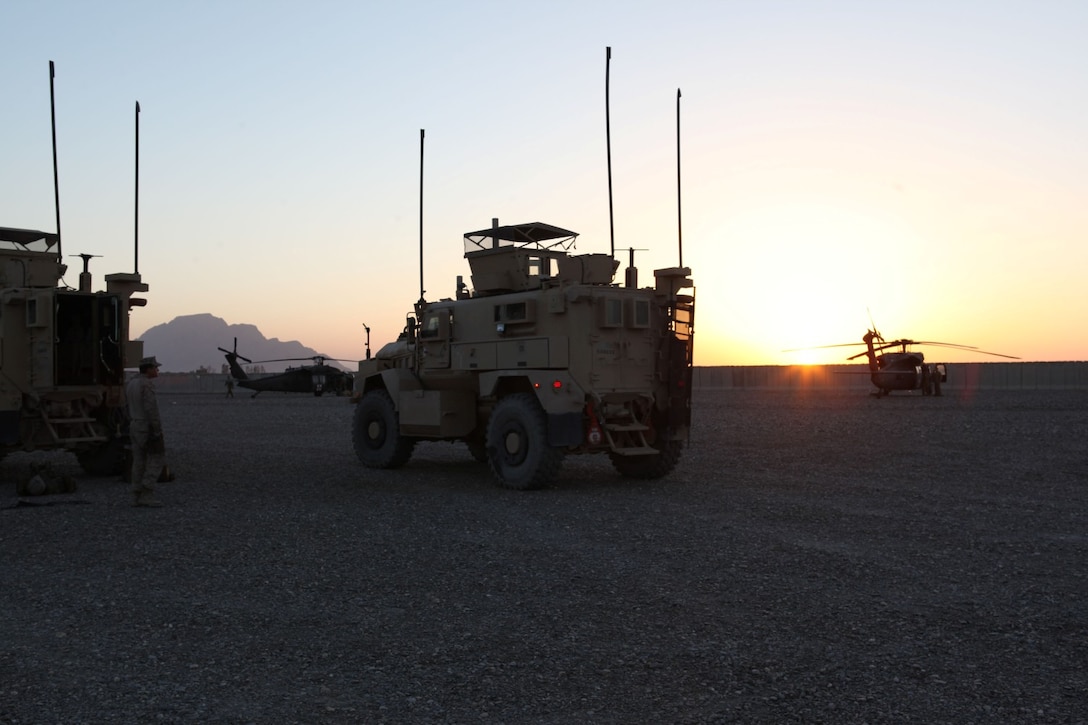 A Mine-Resistant Ambush-Protected vehicle pulls forward into the convoy transporting the last team members of Security Force Assistance Advisor Team 4-215 out of Forward Operating Base Delaram II for the last time, April 8, 2014. The Marines and sailors of SFAAT 4-215 have steadily advised and supported the ANA soldiers in areas of intelligence, surveillance and reconnaissance, and casualty evacuation support, watching them grow in their confidence and ability to stand on their own. While advisors remain at the headquarters level in Helmand province in order to advise and assist as needed, the transfer signifies that 4th Brigade is ready to operate independently of coalition advisors. (USMC Photo By: Sgt. Frances Johnson/Released)