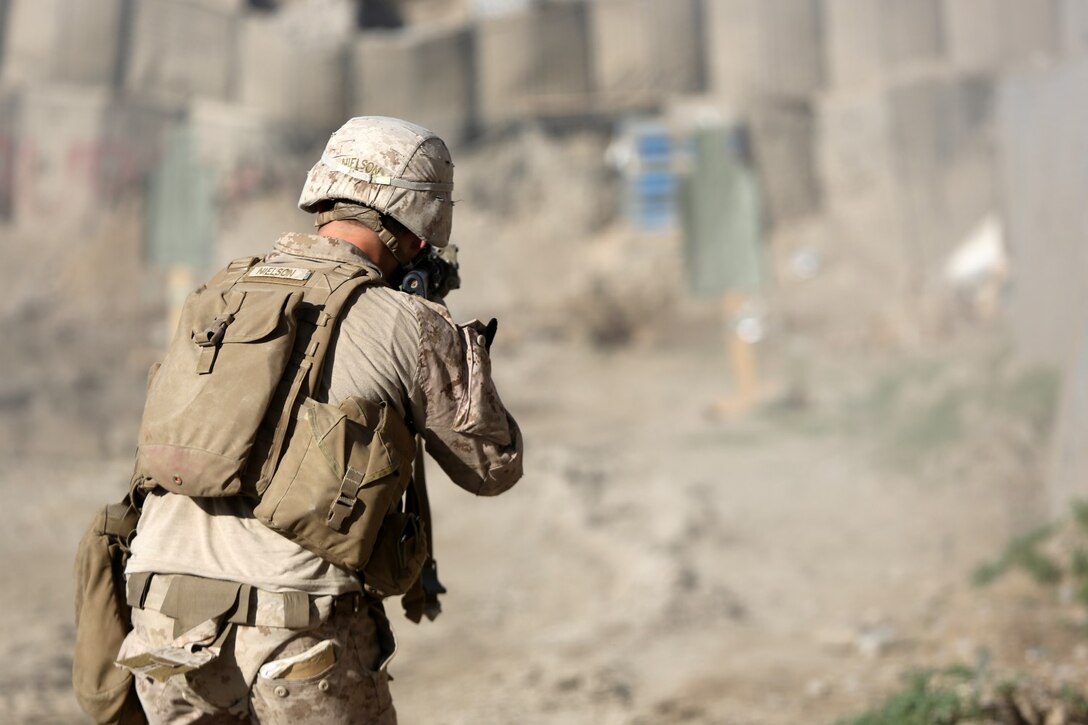 Lance Cpl. Kyler Nielson, rifleman and mine sweeper, Charley Company, 1st Battalion, 7th Marine Regiment, engages targets aboard Forward Operating Base Sabit Qadam, April 9, 2014. Nielson, a native of Las Vegas, enlisted in the Marine Corps when he was 17. He departed for recruit training a month after graduating high school and was set on becoming an infantryman. Shortly after arriving at 1st Bn., 7th Marines, he began a rigorous predeployment training schedule before deploying to Afghanistan. His current mission with Charley Co. is to prepare the transfer of full security responsibilities of Forward Operating Base Sabit Qadam to the Afghan National Army.
(U.S. Marine Corps photo by Cpl. Joseph Scanlan / released)
