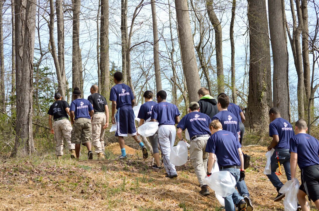 Marines and poolees from Recruiting Sub-Station Glen Burnie prepare to pick up trash from the grounds of the Providence Center in Arnold, Md., which provides care and services for adults with developmental disabilities, April 12, 2014. The event was in honor U.S. Marine Corps Lance Cpl. William T. Wild IV, a native of Severna, Md. who was killed during a training incident in Nevada March 18, 2013, and to improve the living situation for those that live at the Providence Center. The poolees are a part of the Marine Corps’ Delayed Entry Program where they are given a set amount of time to prepare before they are sent to Marine Corps Recruit Depot Parris Island, S.C. where they will try to earn the title of Marine. (U.S. Marine Corps photo by Sgt. Bryan Nygaard/Released)