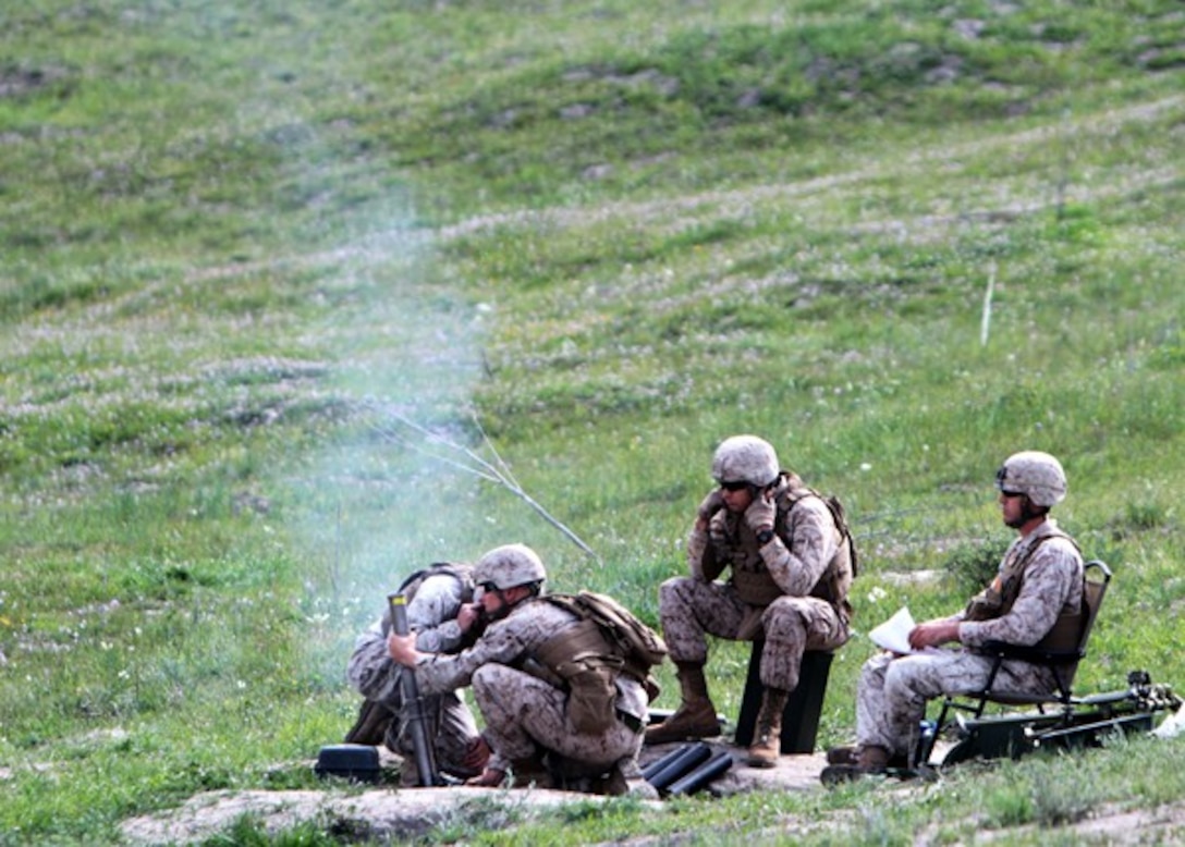 Marines with Weapons Company, 2nd Battalion, 7th Marine Regiment, fire 60 mm mortars during a mortar fire exercise aboard Marine Corps Base Camp Pendleton, Calif., April 4, 2014. The unit, based out of Marine Corps Air Ground Combat Center Twentynine Palms, Calif., came to Camp Pendleton to conduct training on the different types of terrain the base has to offer. The exercise tested the Marine’s ability to fire on unknown distance targets with 60 mm and 81 mm mortars. (U.S. Marine Corps photo by Lance Cpl. Joshua Murray/Released)