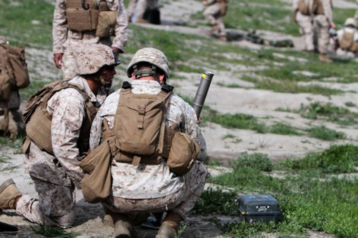 Marines with Weapons Company, 2nd Battalion, 7th Marine Regiment, prepare to fire 60 mm mortars during a mortar fire exercise aboard Marine Corps Base Camp Pendleton, Calif., April 4, 2014. The unit, based out of Marine Corps Air Ground Combat Center Twentynine Palms, Calif., came to Camp Pendleton to conduct training on the different types of terrain the base has to offer. The exercise tested the Marine’s ability to fire on unknown distance targets with 60 mm and 81 mm mortars. (U.S. Marine Corps photo by Lance Cpl. Joshua Murray/Released)