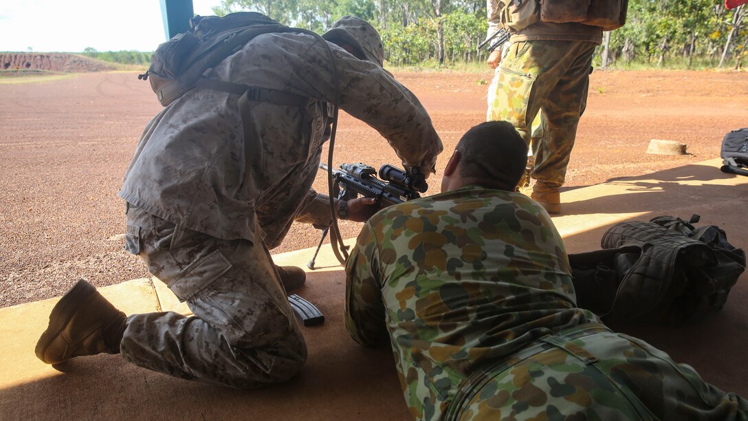 A Soldier with the Australian Army prepares to fire a M4 Carbine, aboard Robertson Barracks, April 15, 2014. The Australians fired the M4 carbine, the M16A4 Service Rifle and the M27 infantry automatic rifle. The Marines also instructed them on the proper use and care of the weapon systems.