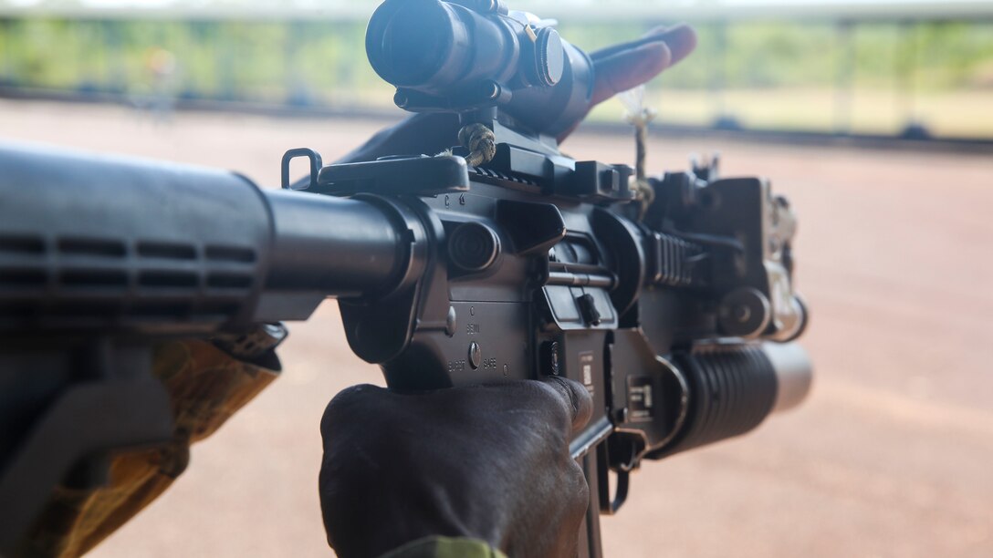 A Soldier with the Australian Army prepares to fire a M4 Carbine, aboard Robertson Barracks, April 15, 2014. The Australians fired the M4 carbine, the M16A4 Service Rifle and the M27 infantry automatic rifle. The Marines also instructed them on the proper use and care of the weapon systems.