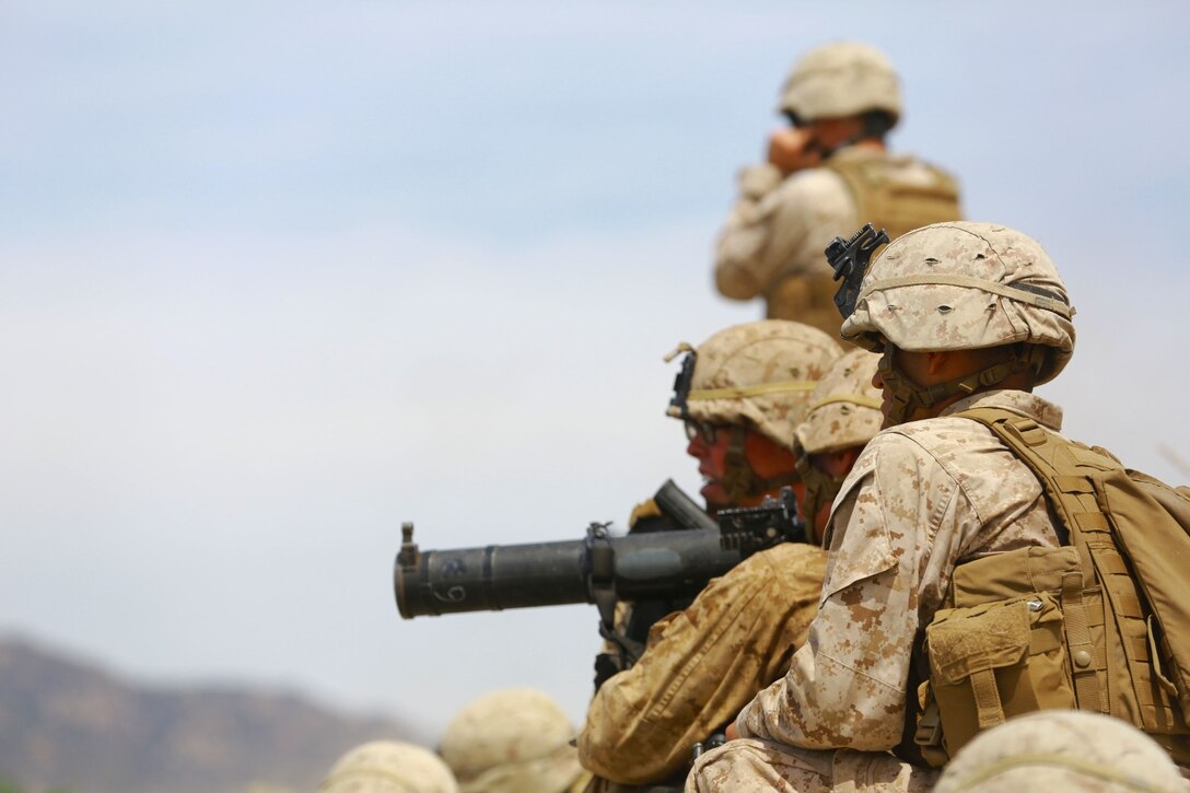 Marines with 1st Battalion, 1st Marine Regiment, patrol during a squad tactics exercises aboard Marine Corps Base Camp Pendleton, Calif., April 9, 2014. The exercise gave assualtmen, mortarmen and machine-gunners an opportunity to coordinate with each other while assaulting through enemy positions during a large-scale raid. 1st Bn., 1st Marines, conducted this training in preparation for their upcoming deployment to Okinawa, Japan.
