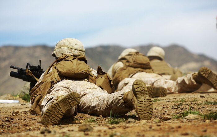 Marines with 1st Battalion, 1st Marine Regiment, patrol during a squad tactics exercises aboard Marine Corps Base Camp Pendleton, Calif., April 9, 2014. The exercise gave assualtmen, mortarmen and machine-gunners an opportunity to coordinate with each other while assaulting through enemy positions during a large-scale raid. 1st Bn., 1st Marines, conducted this training in preparation for their upcoming deployment to Okinawa, Japan.