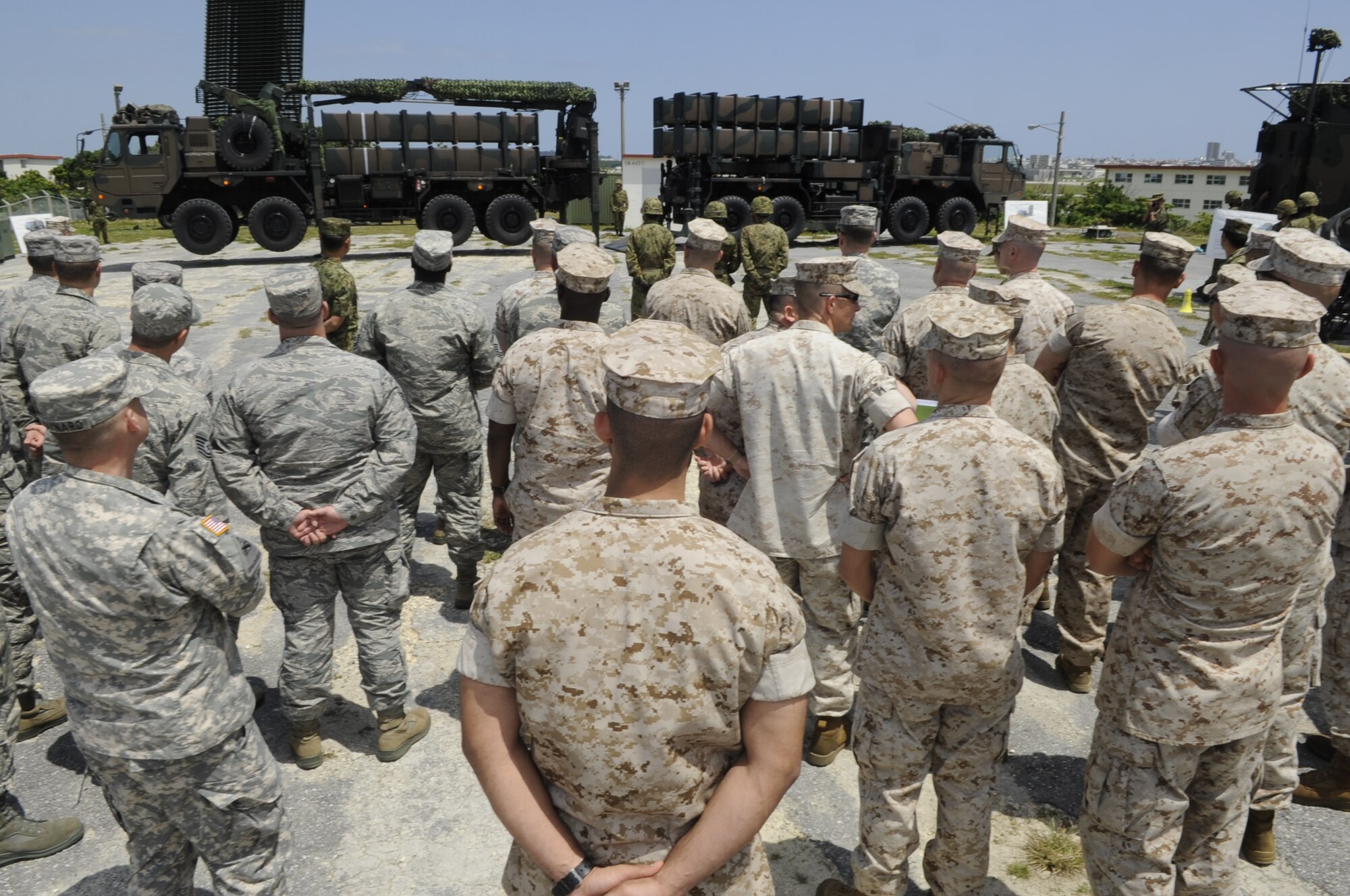 The Japan Ground Self-Defense Force demonstrates their air defense capabilities to U.S. military members on Marine Corps Air Station Futenma, Japan, April 15, 2014. Some of the capabilities they covered were loading their launcher units, their multi-function firing radar and their fire control posts. (U.S. Air Force photo by Senior Airman Marcus Morris)