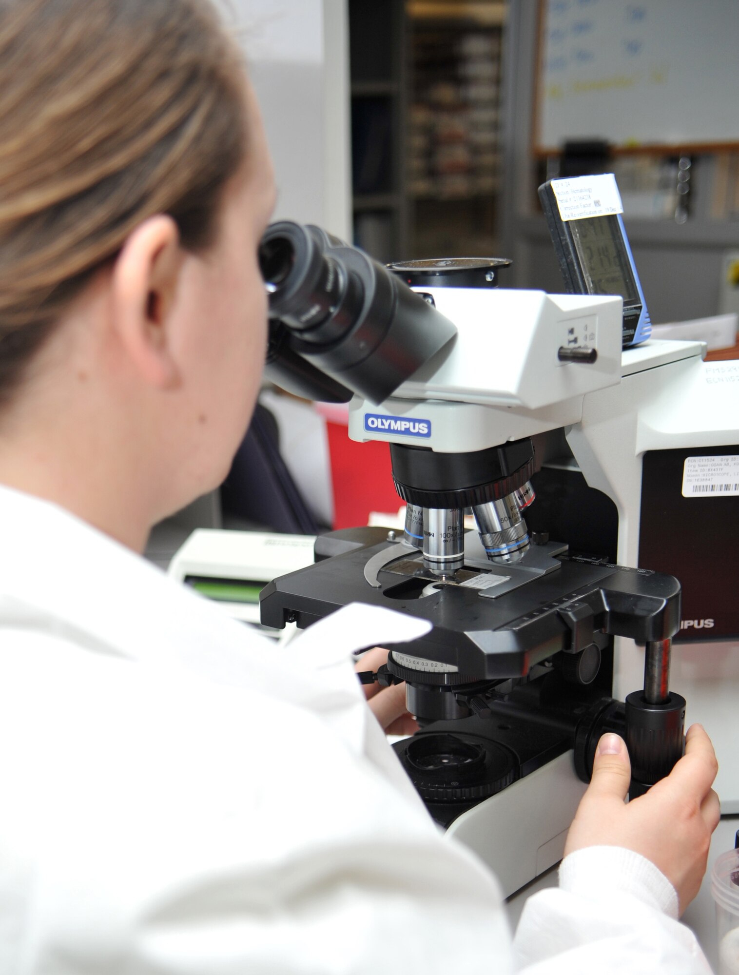 Staff Sgt. Lindsay Palson, 51st Medical Support Squadron medical laboratory technician, observes a joint fluid specimen under a microscope in the 51st Medical Group at Osan Air Base, Republic of Korea, April 17, 2014. The 51st MDG’s lab technicians provide biochemical results to doctors and other healthcare providers for the thousands of beneficiaries at Osan. (U.S. Air Force photo/Airman 1st Class Ashley J. Thum)