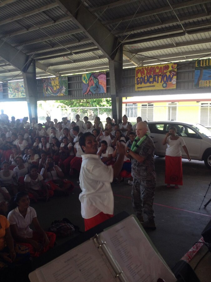 American Samoa-- TSgt Michael Smith competes in a dance-off with one of the students from Samoana High School on March 26, 2014. (US Air Force Photo, SSgt Courtney Clifford/Released) 