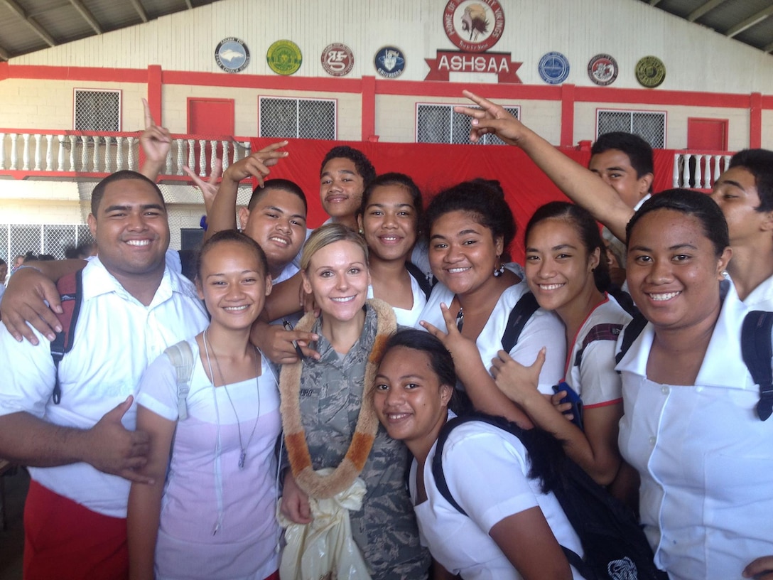 American Samoa-- SSgt Courtney Clifford takes photos with students from Faga'itua High School, Mar 25th, 2014. (US Air Force Photo, SSgt Courtney Clifford/Released) 
