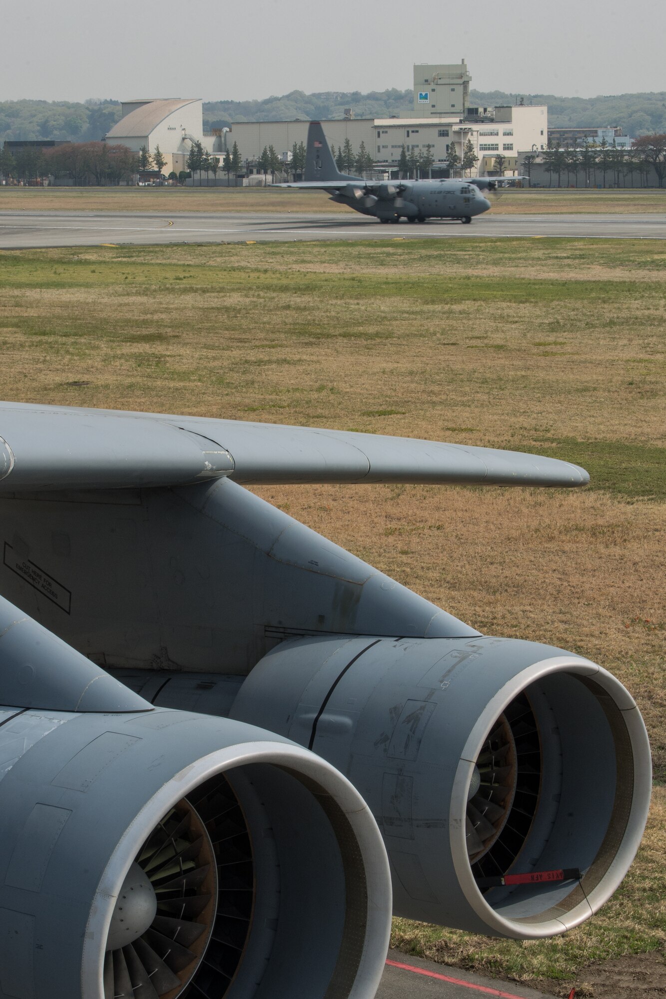 A C-130 Hercules from the 36th Airlift Squadron takes off from Yokota Air Base, Japan, April 16, 2014. Six C-130Hs launched in support of regional operations. The Hercules was one of six that launched from Yokota to test large force employement and tactics. (U.S. Air Force photo by Osakabe Yasuo/Released)