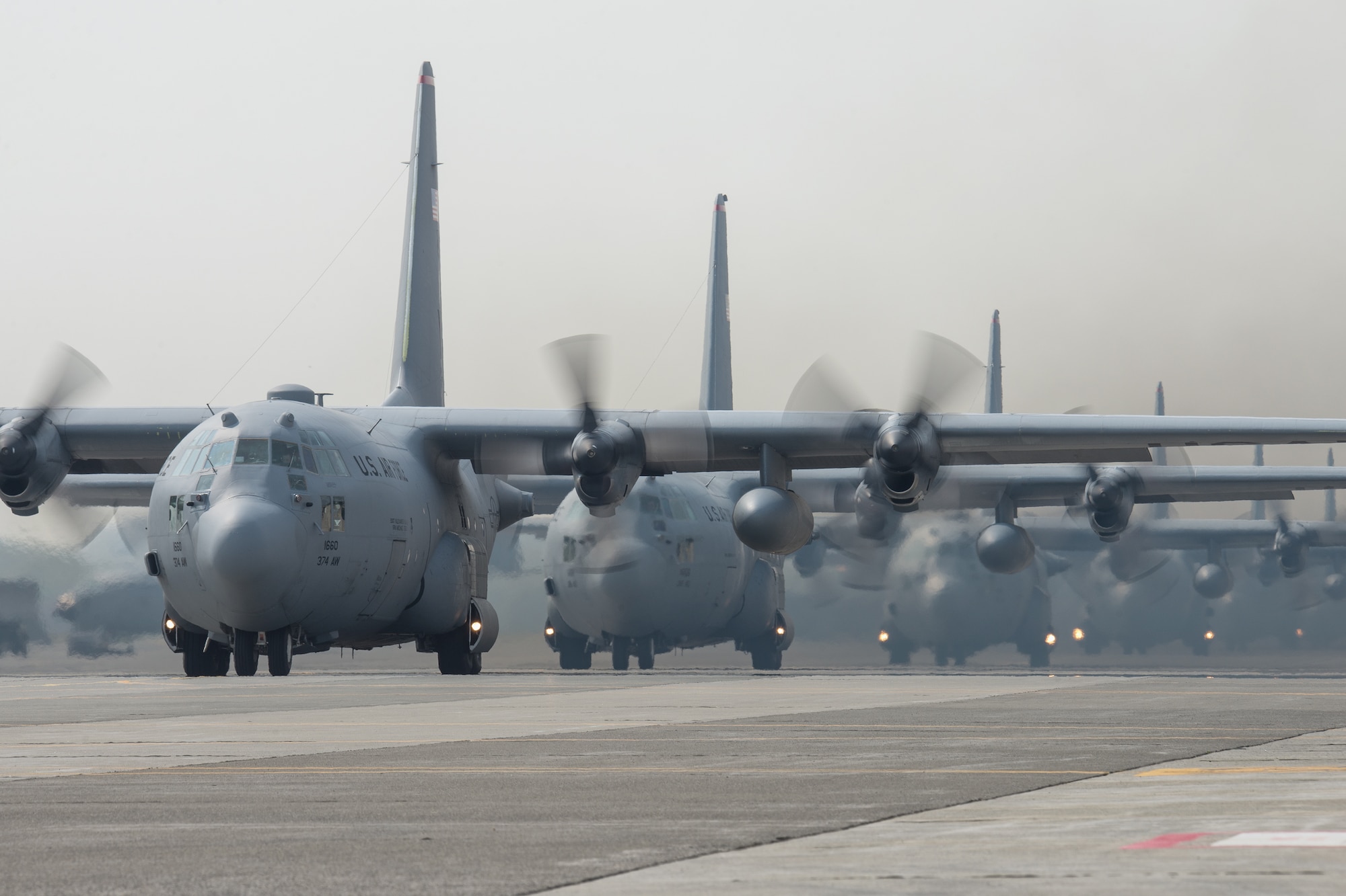 Six C-130 Hercules from the 36th Airlift Squadron taxi out to support regional operations at Yokota Air Base, Japan, April 16, 2014. The exercise tested Yokota’s ability to perform large-force employment and tactics. (U.S. Air Force photo by Osakabe Yasuo/Released)