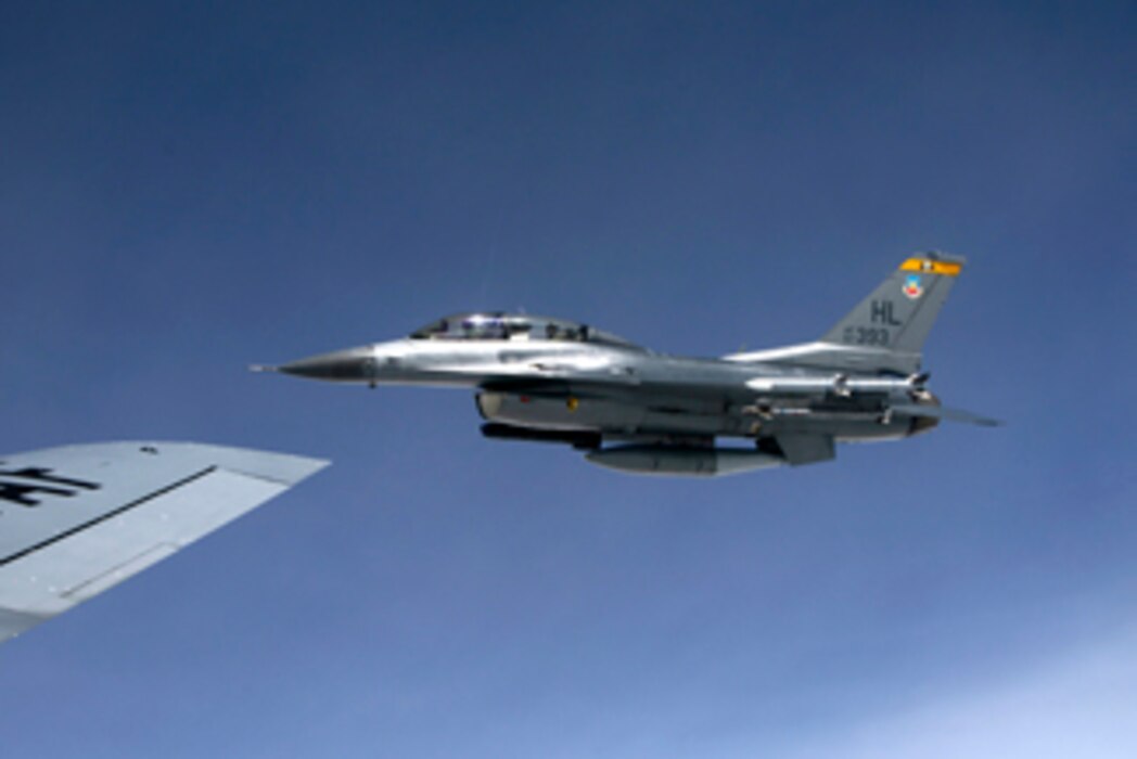 Maj. Gen. Jefferson Burton, adjutant general of the Utah National Guard, flies alongside a KC-135 Stratotanker over Utah's West Desert during the "Lone Survivor" training exercise on April 12, 2014. (Utah Air National Guard photo by Staff Sgt. Annie Edwards/RELEASED)