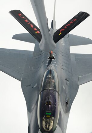 Maj. Gen. Jefferson Burton, adjutant general of the Utah National Guard, gives a thumbs-up to the boom operator of a KC-135 Stratotanker from the 151st Air Refueling Wing, April 12, 2014. Burton got a first-hand look at the state's first-ever "Lone Survivor" training exercise, in which citizen Soldiers and Airmen worked together to find and rescue two "downed" F-16 pilots stranded in Utah's West Desert. (Utah Air National Guard photo by Staff Sgt. Annie Edwards/RELEASED)