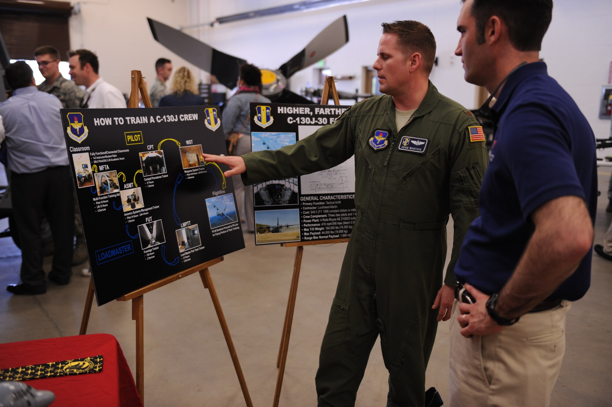 Major Adam Wantuck, 314 Airlift Wing director of staff, explains to a member of the Leadership Greater little Rock tour what goes into training a C-130 aircrew member during the Leadership Greater Little Rock tour April 10, 2014, at Little Rock Air Force Base, Ark.  The Leadership Greater Little Rock program has graduated more than 1,300 community leaders from its training program. (U.S. Air Force photo by Airman 1st Class Cliffton Dolezal)