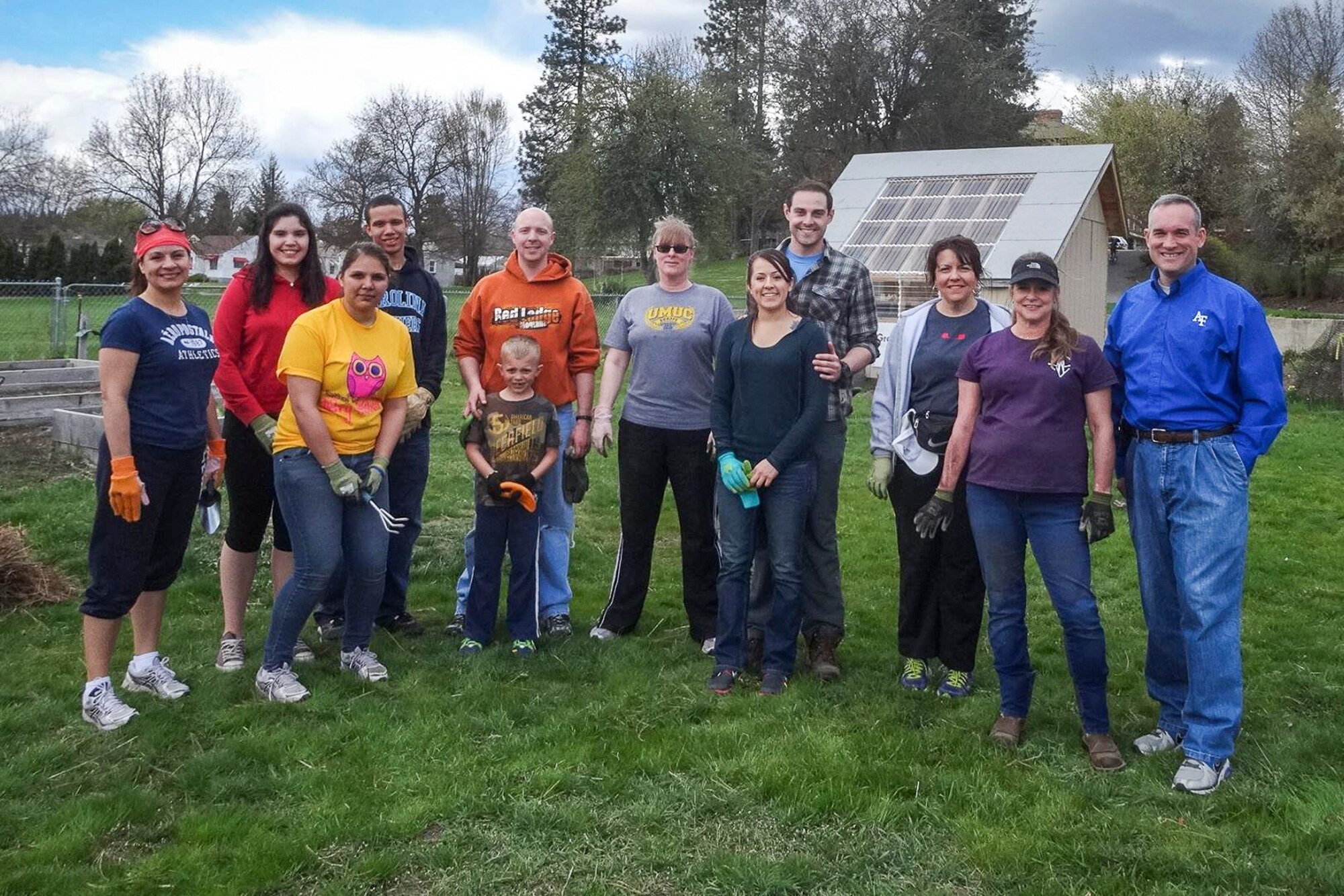 Fairchild Airmen pose for a photo at the Inland Northwest Council Boy Scouts of America Urban Tree Renewal Project, in Meade, Wash., as part of "Spokane Gives Week" April 14, 2014. The volunteers planted 4,200 seedling trees at the event. (Courtesy photo)