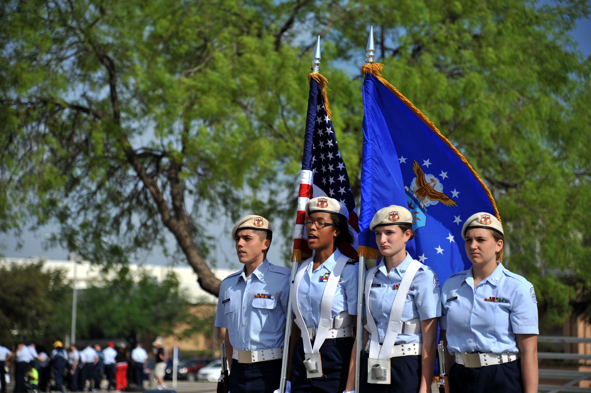 SAN ANGELO, Texas – Burkburnett High School Air Force Junior ROTC Cadets stand at attention during a color guard drill routine at Angelo State University’s annual Junior ROTC Drill Meet here April 12. The color guard competition required four members, two bearing flags and two bearing arms. (U.S. Air Force photo/ Airman 1st Class Devin Boyer)