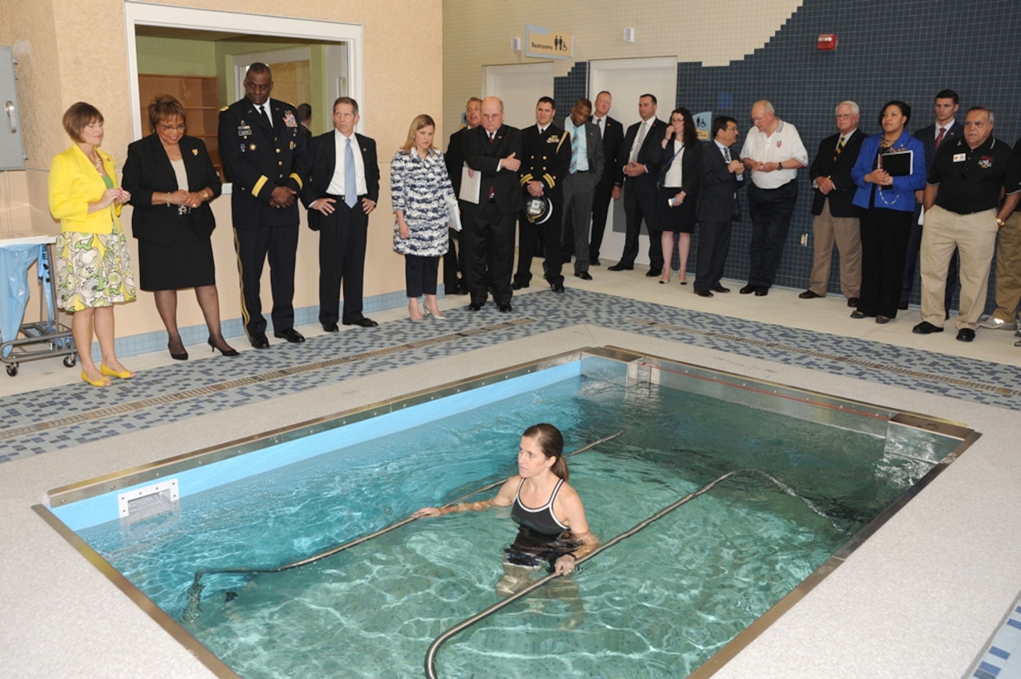 Dr. Kerry Allen, physical therapist, demonstrates hydrotherapy during an open house for the  James A. Haley Veterans’ Hospital’s new Polytrauma and Rehabilitation Center, Apr. 12, 2014. The hydrotherapy pool will be used for patient rehabilitation and massage therapy. (U.S. Air Force photo/ Staff Sgt. Liliana Moreno)