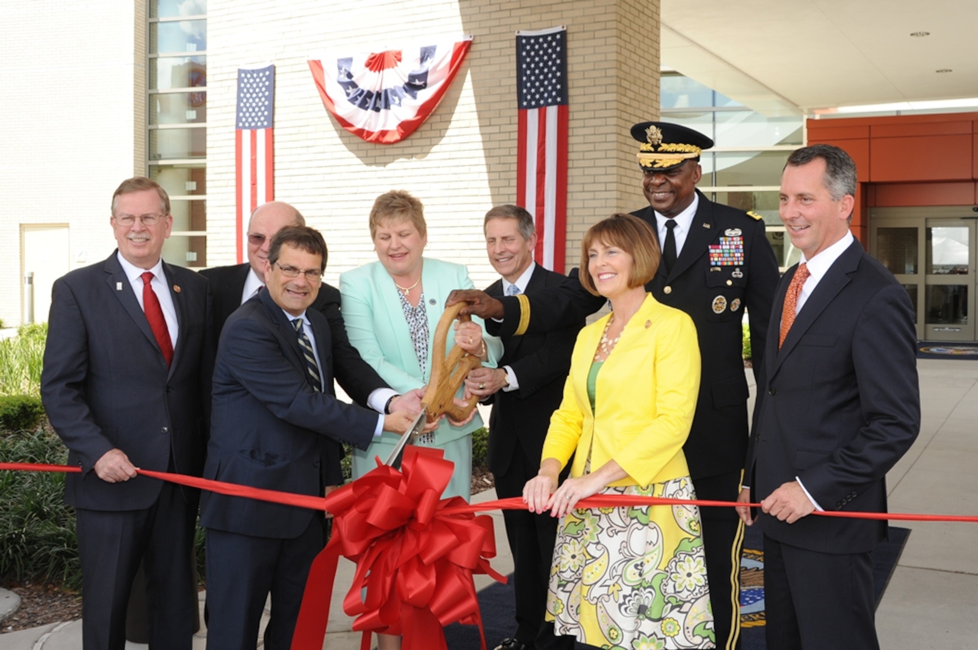 Gen. Lloyd J. Austin III, commander of U.S. Central Command (second from right), and other leaders in the Tampa community participate in the ribbon cutting ceremony for the new Polytrauma and Rehabilitation Center at the James A. Haley Veterans’ Hospital, Apr. 12, 2014. (U.S. Air Force photo by Staff Sgt. Liliana Moreno)