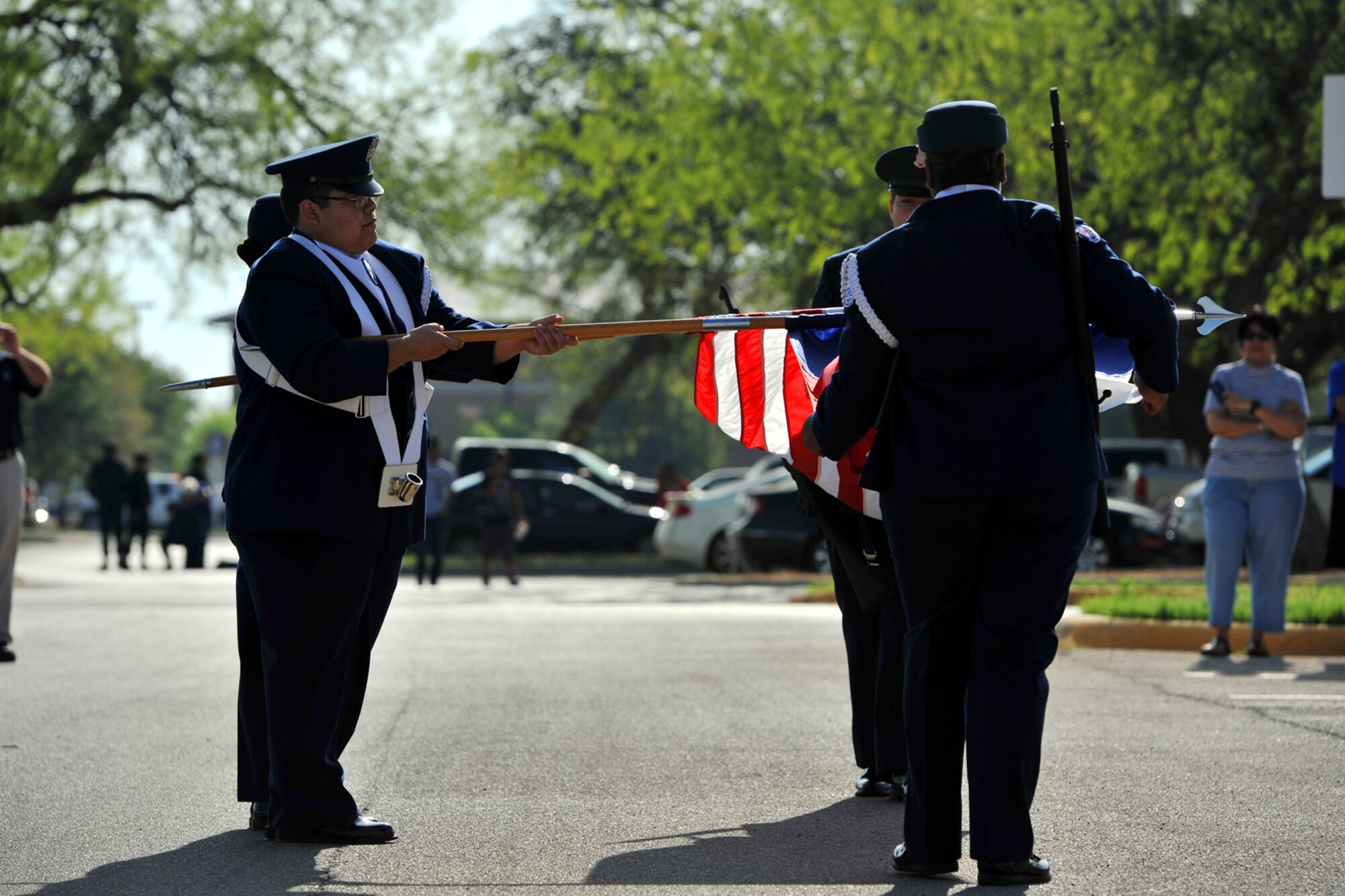 SAN ANGELO, Texas – Lakeview High School Junior ROTC Cadets case the colors during a color guard drill routine at Angelo State University’s annual Junior ROTC Drill Meet here April 12. The color guard competition required four members, two bearing flags and two bearing arms. (U.S. Air Force photo/ Airman 1st Class Devin Boyer)