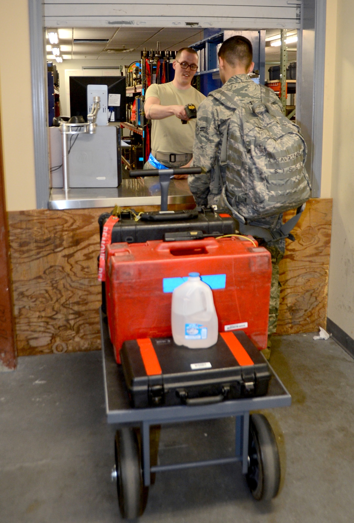 Staff Sgt. Andrew McNeil, 20th Aircraft Maintenance Unit Support custodian, checks tools turned in by Senior Airman Alexander Stavrinos, 2nd Aircraft Maintenance Squadron, on Barksdale Air Force Base, La., April 15, 2014. All the equipment, such as non-powered and minor tools and servicing and test equipment, sets that are used to troubleshoot electronic and hydraulic faults, for the aircraft are located in the support section. (U.S. Air Force photo/Staff Sgt. Amber Corcoran)