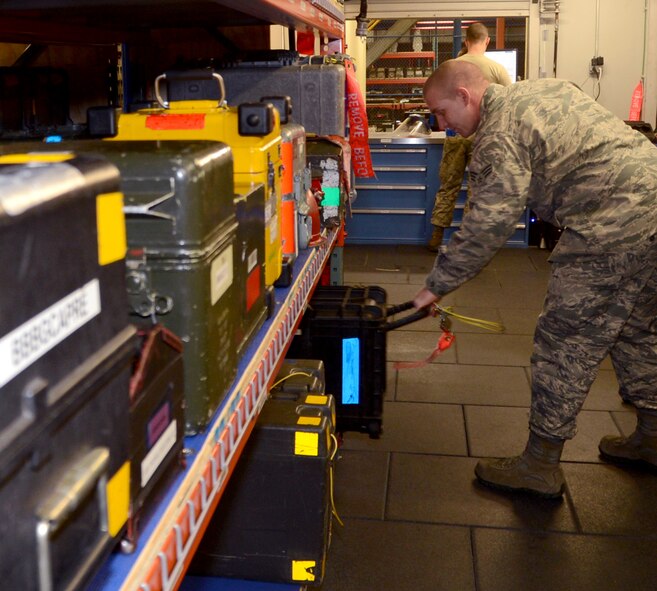 Senior Airman Garret Dunlap, 20th Aircraft Maintenance Unit Support custodian, pulls equipment to issue to an Airman on Barksdale Air Force Base, La., April 15, 2014. The level of labor building the new AMU shop consisted of physically relocating between 1,500 and 2,000 different tools and equipment weighing anywhere between five and 250 pounds, building shelves, cutting wood and creating the database for the tools and loading every single item. (U.S. Air Force photo/Staff Sgt. Amber Corcoran)
