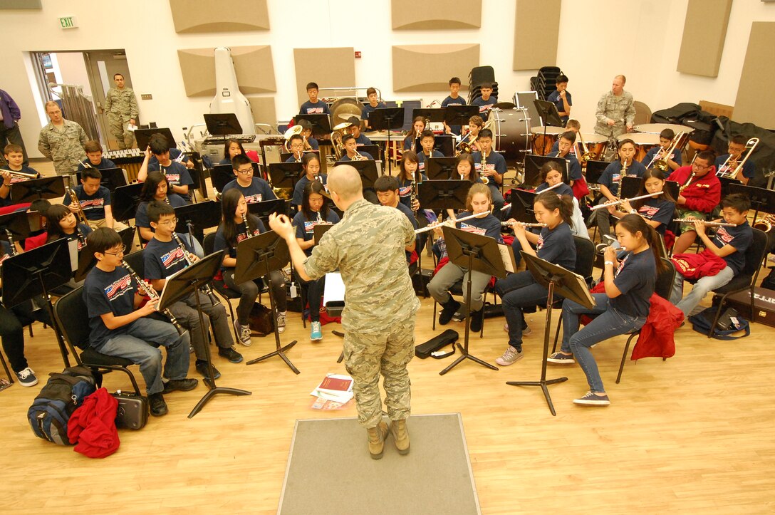 Flight Commander of the Heritage of America Band 2LT Justin W. Lewis conducts Chaparral Middle School Band from Diamond Bar, CA. The students were visiting as part of an educational/band festival tour. 2LT Lewis coached the students and director for their spring concert series.
