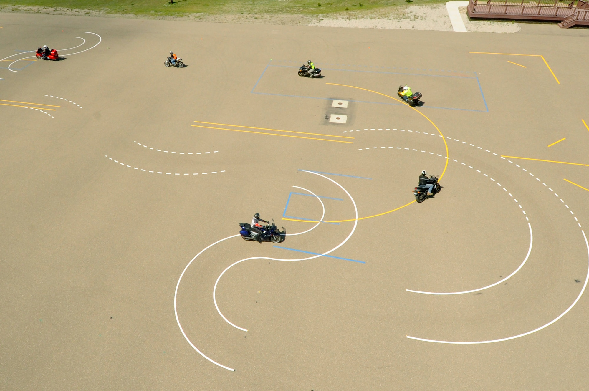 Members of Vandenberg Air Force Base navigate their bikes through a newly constructed safety course, April 15, 2014, Vandenberg Air Force Base, Calif. In addition to classes being offered on a regular basis, personnel are encouraged to utilize the course layout at their leisure. (U.S. Air Force photo/ Senior Airman Shane Phipps) 
