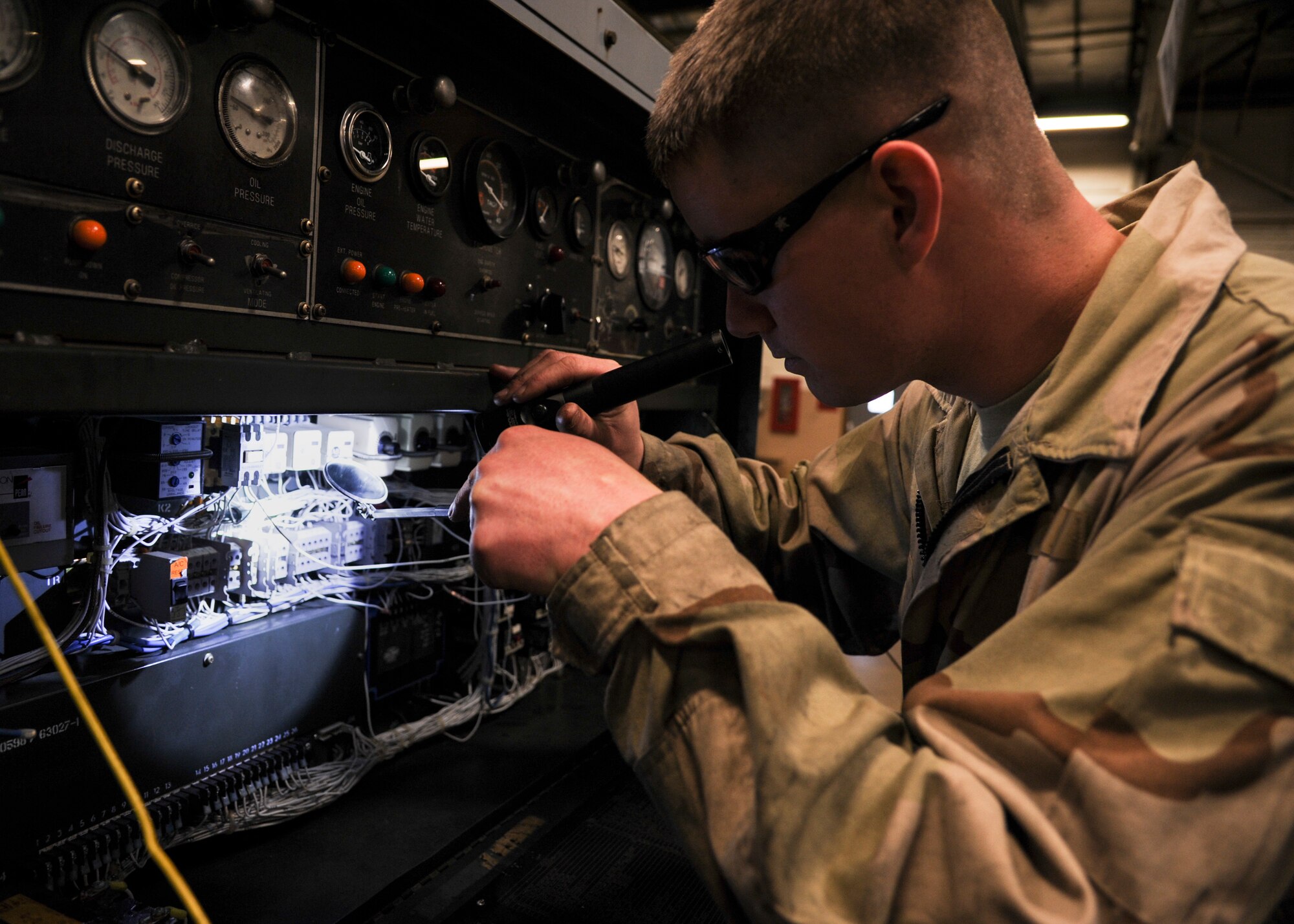 Staff Sgt. George Reves, a 19th Equipment Maintenance Squadron aerospace ground equipment craftsman, inspects the electrical components of a generator April 8, 2014, at Little Rock Air Force Base, Ark. AGE inspects hundreds of pieces of equipment that are essential in getting C-130s in the air. (U.S. Air Force photo by Airman 1st Class Harry Brexel)  
