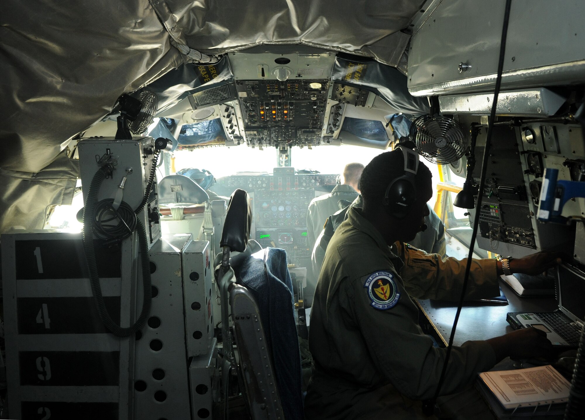 Senior Airman Devaughn Granger, 351st Air Refueling Squadron boom operator from Rome, N.Y., prepares the flight deck of a KC-135 Stratotanker for takeoff April 16, 2014, at RAF Mildenhall, England. Preparing the flight deck is one of the first steps aircrew members take to ensure the aircraft is safe and organized for flight. (U.S. Air Force photo by Senior Airman Kate Maurer/Released)