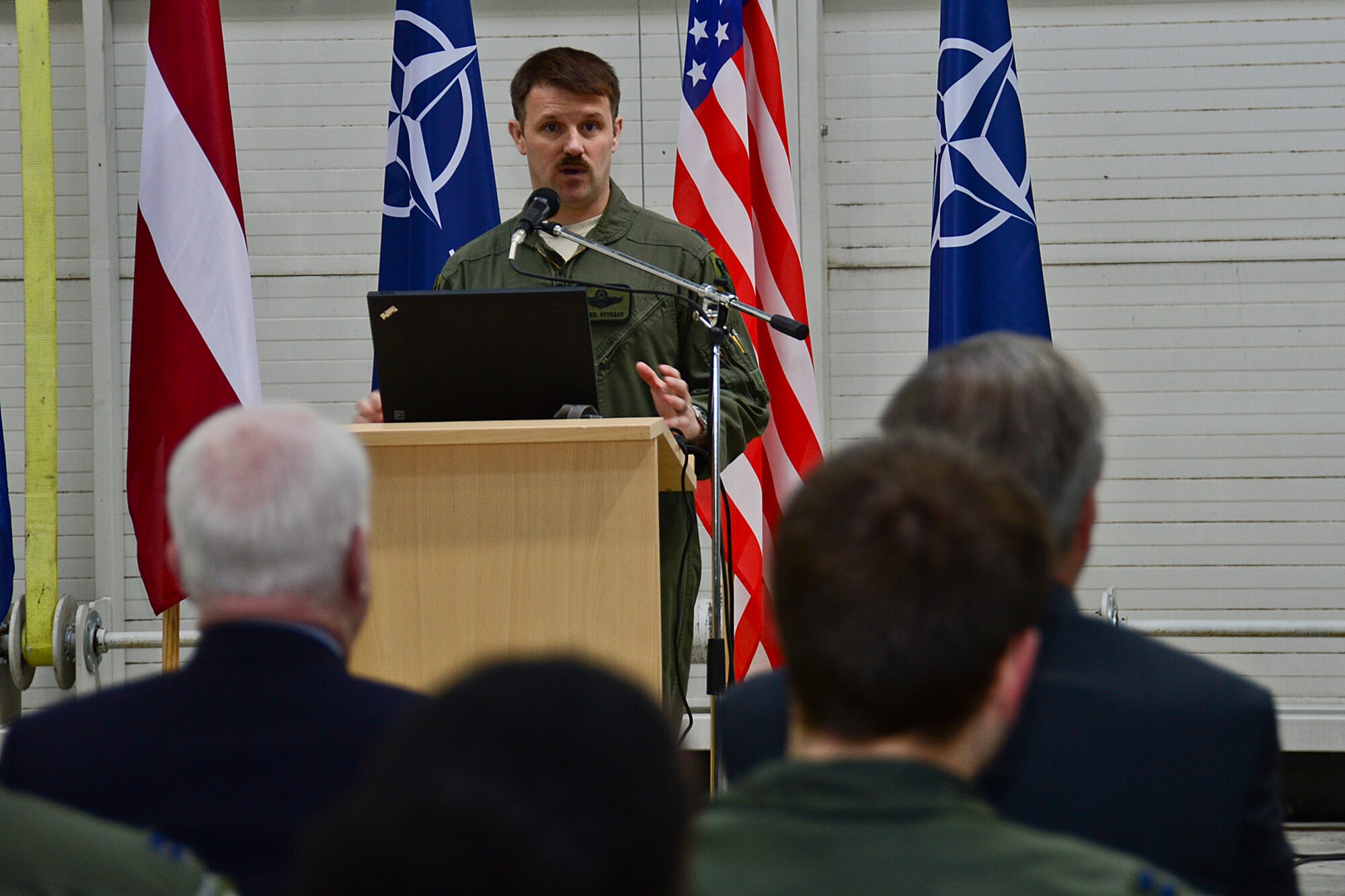 Lt. Col. Lendy Renegar, 48th Air Expeditionary Group commander, explains the Baltic Air Policing mission to U.S. Senators John McCain, John Hoeven and John Barrasso at Šiauliai Air Base, Lithuania, April 16, 2014. The Senators visited the BAP mission as part of a visit to the greater Baltic region, which also includes meetings with government officials in Estonia, Latvia, and Moldova. (U.S. Air Force photo by Airman 1st Class Dana J. Butler/Released)