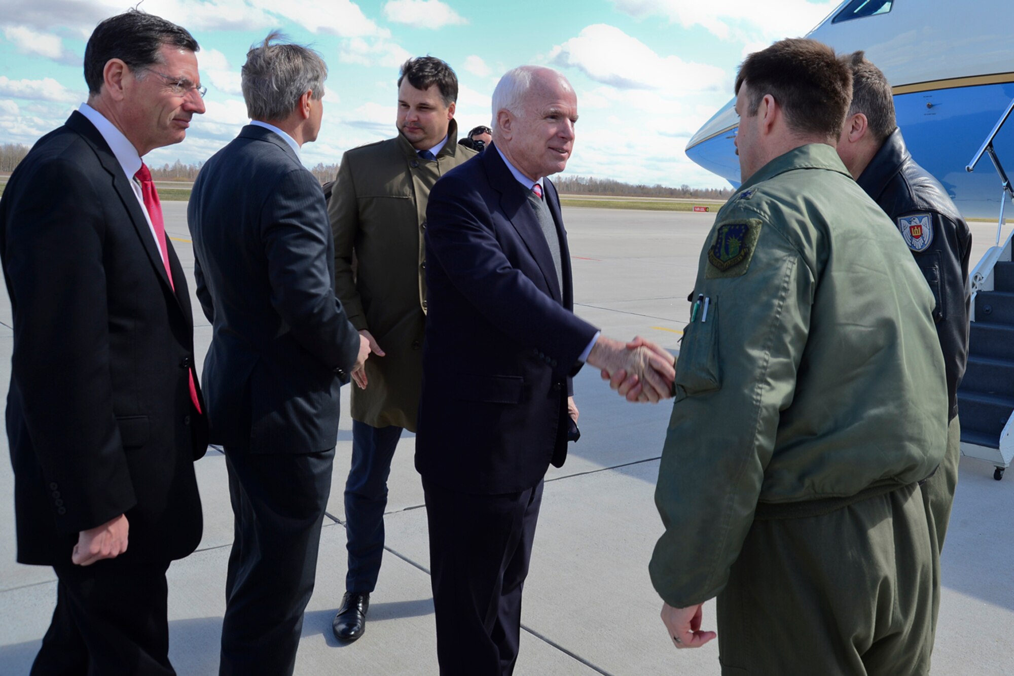 U.S. Senator John McCain shakes the hand of Lt. Col. Lendy Renegar, 48th Air Expeditionary Group commander, before leaving Šiauliai Air Base, Lithuania, April 16, 2014. McCain and U.S. Senators John Hoeven and John Barrasso visited the Baltic Air Policing mission as part of a visit to the greater Baltic region, which also includes meetings with government officials in Estonia, Latvia, and Moldova. (U.S. Air Force photo by Airman 1st Class Dana J. Butler/Released)