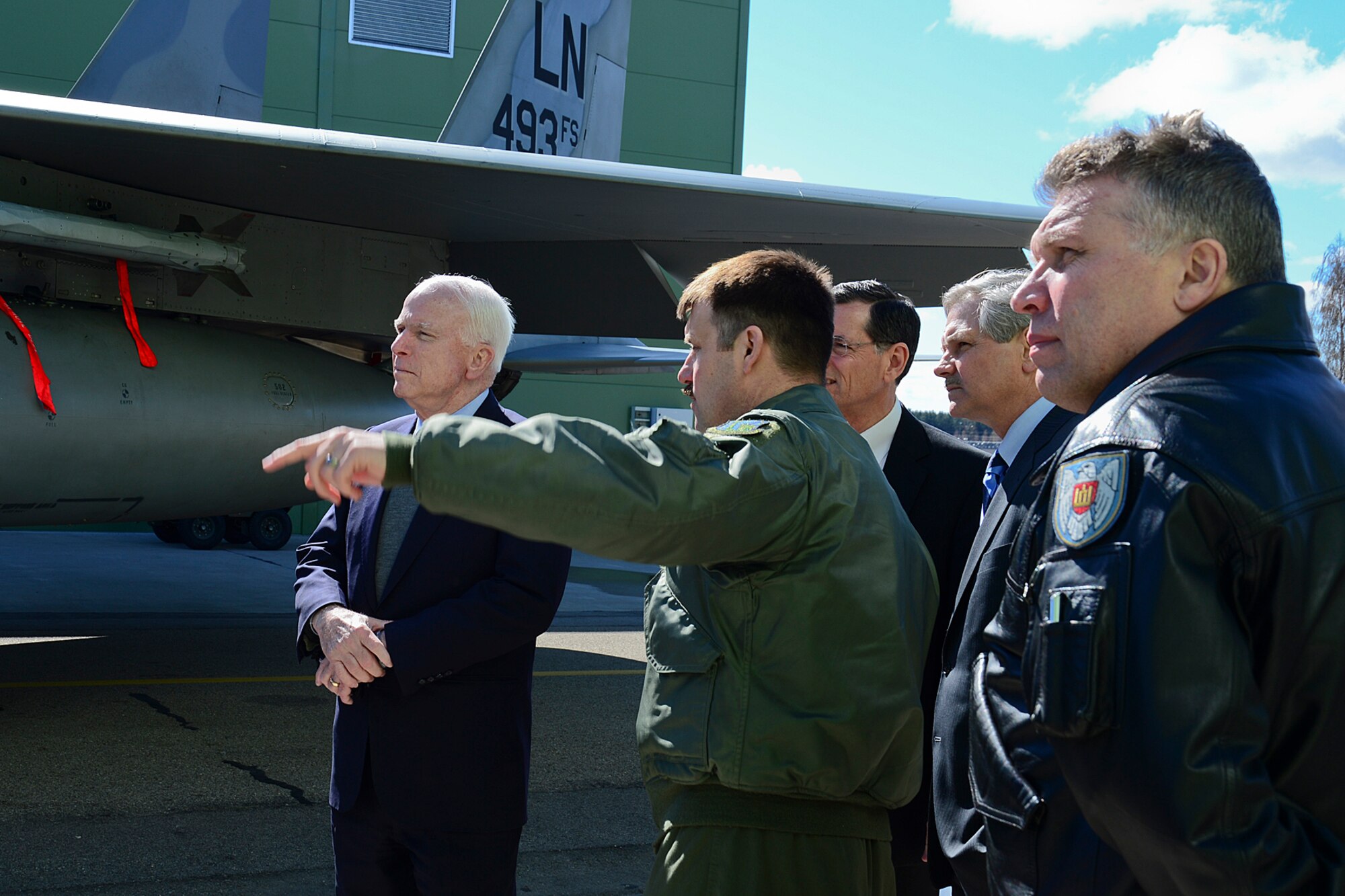 Lt. Col. Lendy Renegar, 48th Air Expeditionary Group commander, explains the capabilities of the F-15C Eagle to U.S. Senators John McCain, John Hoeven and John Barrasso at Šiauliai Air Base, Lithuania, April 16, 2014. The Senators visited the Baltic Air Policing mission as part of a visit to the greater Baltic region, which also includes meetings with government officials in Estonia, Latvia, and Moldova. (U.S. Air Force photo by Airman 1st Class Dana J. Butler/Released)
