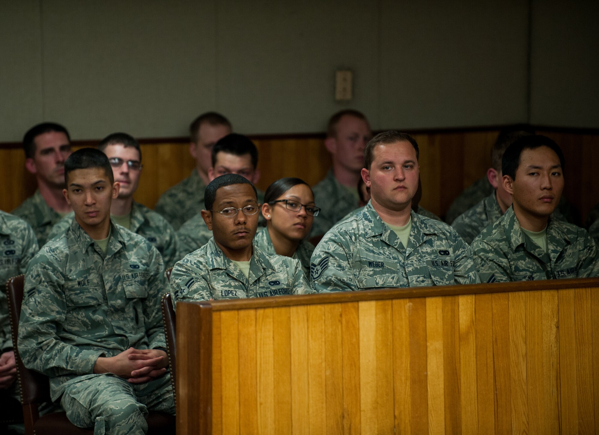 Airmen from the First Term Airman Center and the Noncommissioned Officer Professional Enhancement seminar observe a mock trial at Kunsan Air Base, Republic of Korea, April 16, 2014. The Wolf Pack puts on a mock trial of a sexual assault case for FTAC students to provide a realistic view of the military justice system. (U.S. Air Force photo by Staff Sgt. Clayton Lenhardt/Released)