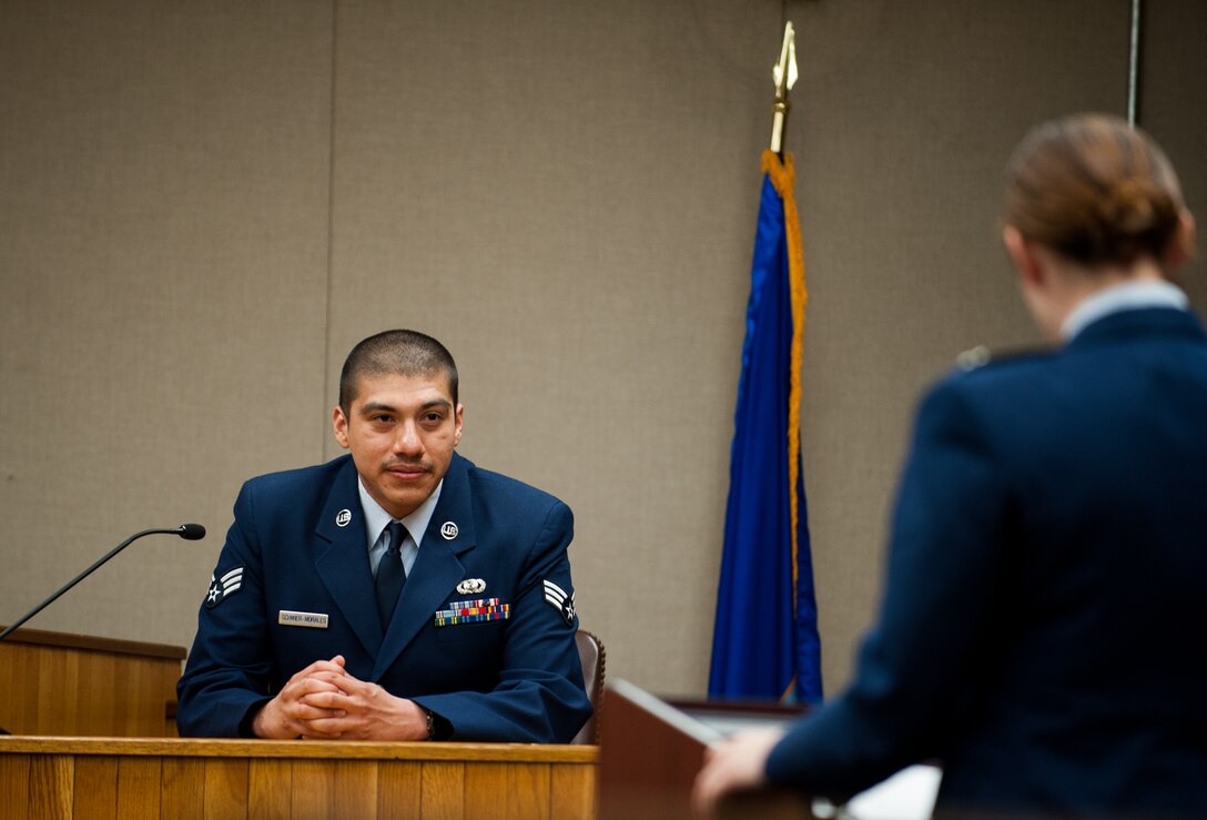 Armando Schwier-Morales, 8th Fighter Wing Public Affairs, testifies during a mock trial at Kunsan Air Base, Republic of Korea, April 16, 2014. The Wolf Pack puts on a mock trial of a sexual assault case for First Term Airman Center students to provide a realistic view of the military justice system. (U.S. Air Force photo by Staff Sgt. Clayton Lenhardt/Released)