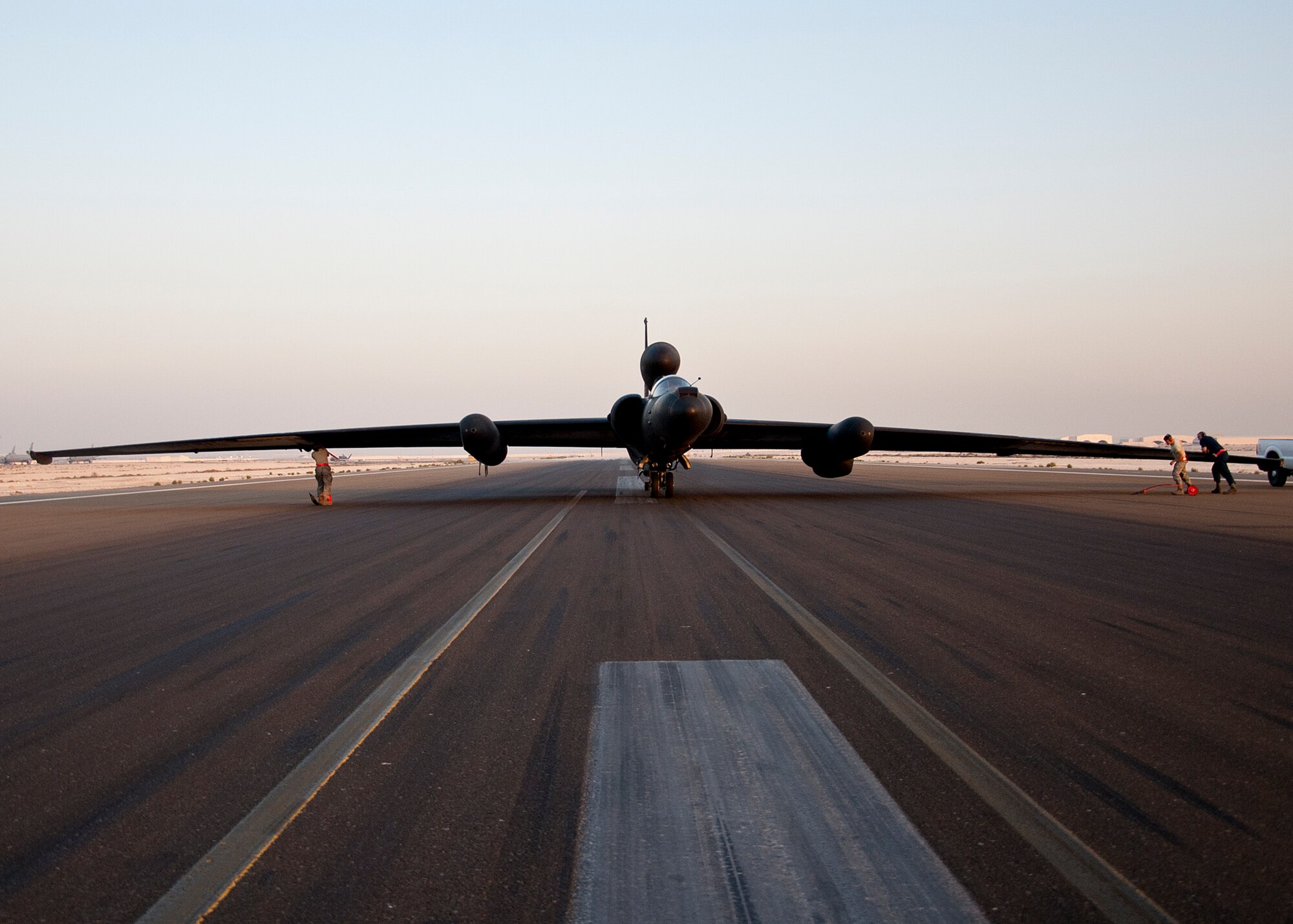 Members of the 380th Expeditionary Aircraft Maintenance Squadron’s Dragon Aircraft Maintenance Unit, get ready to place pogo wheels on the U-2 Dragon Lady moments after landing at an undisclosed location in Southwest Asia, March 24, 2014. These bicycle-type wheels are used to support the aircraft's extended wingspan during taxi for all take offs and landings. It’s the unique design that gives the U-2 its remarkable performance and makes flying very challenging. (U.S. Air Force photo by Staff Sgt. Michael Means/Released)
