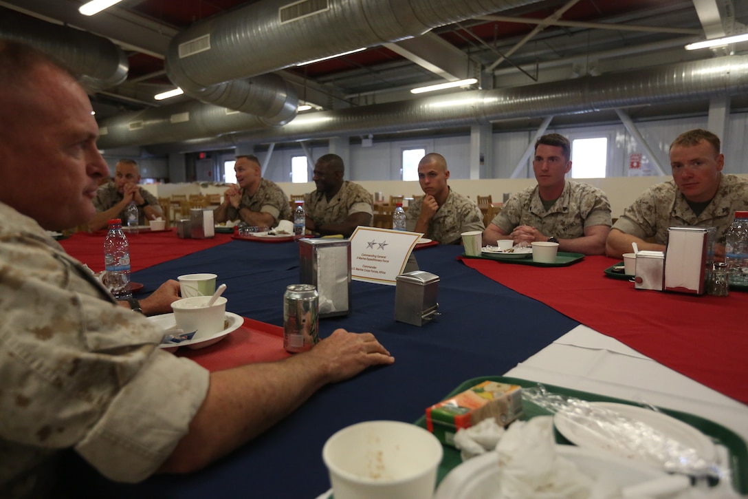 U.S. Marine Corps Maj. Gen. Raymond C. Fox, commanding general of II Marine Expeditionary Force, and commander of U.S. Marine Corps Forces, Africa, eats lunch with Marines and sailors of 3rd Battalion, 8th Marine Regiment, assigned to Black Sea Rotational Force 14, as well as Marines from Lima Company, 3rd Battalion, 8th Marine Regiment, part of Special Purpose Marine Air-Ground Task Force Crisis Response during a command visit to Mihail Kogalniceanu, Romania, April 16, 2014. BSRF-14 is a contingent of Marines and sailors in the Black Sea, Balkans and Caucasus regions that work with partner nations to maintain proven partnerships while building military capacity, promoting regional stability, and providing the capability for rapid crisis response throughout Eastern Europe as directed by U.S. Marine Corps Forces Europe and Africa, U.S. European Command. The Marines and sailors of SPMAGTF-Crisis Response provide crisis response capability in support of U.S. and partner-nation security interests and participate in training engagements with regional partners within their area of responsibility.