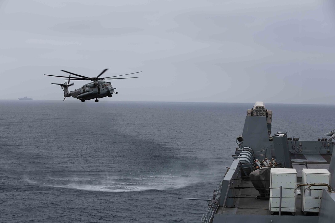 A CH-53E Super Stallion from Marine Medium Tiltrotor Squadron 163 (Reinforced), 11th Marine Expeditionary Unit, prepares to land on the flight deck of the USS San Diego during Amphibious Squadron Marine Expeditionary Unit Integration Training (PMINT) off the coast of San Diego, April 17, 2014. For the 11th MEU and the Makin Island Amphibious Ready Group PMINT the first opportunity for the MEU/ARG team to exercise its planning processes and conduct sea-based operations. (U.S. Marine Corps photo by Cpl. Jonathan R. Waldman/RELEASED)