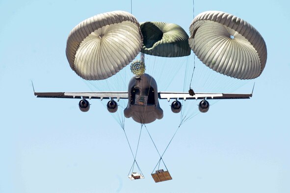 Members of the 58th Airlift Squadron release unilateral airdrop training loads from a C-17 Globemaster III during an airdrop training mission at the Sooner Drop Zone April 11, 2014, near Hollis, Okla. The 97th Aerial Operations Flight prepares airdrop cargo pallets and loads them onto the C-17s. Their mission provides C-17 aircrews with realistic training scenarios, which consist of on and off loading general cargo and vehicles as well as aerial delivery materials for airdrop training. (U.S. Air Force photo/Senior Airman Jesse Lopez)