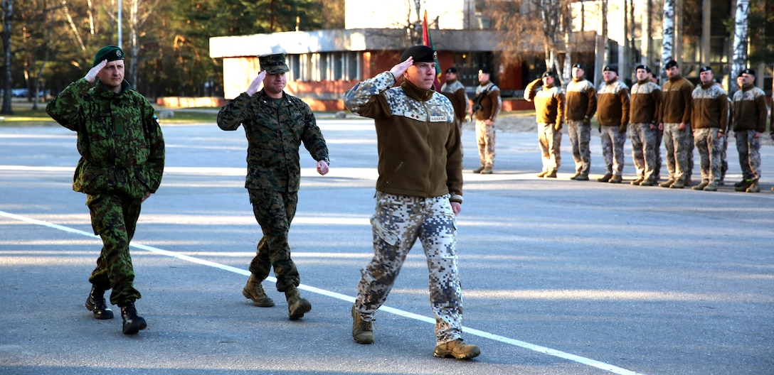 Latvian Lt. Col. Gunars Kaulins, the exercise director of Summer Shield, U.S. Marine Lt. Col. Trevor Hall, the battalion commander of Black Sea Rotational Force 14 from 3rd Battalion, 8th Marine Regiment, 2nd Marine Division, and Estonian Lt. Col. Kaarel Maesalu, the battalion commander of the Estonian Defense Forces Artillery Battalion, march to their positions in front of the parade for the closing ceremony of exercise Summer Shield aboard Camp Adazi, Latvia, April 16, 2014. This is the 11th iteration of the Summer Shield exercise, a joint staff planning and live-fire maneuver event designed to enhance the NATO force’s capacity and capability to integrate combined arms and maneuver at the battalion and brigade level. It also increases partner capacity, promotes regional stability, and enhances Latvian, Lithuanian, Estonian, and U.S. interoperability as NATO allies. (Official Marine Corps photo by Lance Cpl. Scott W. Whiting, BSRF PAO/ Released)