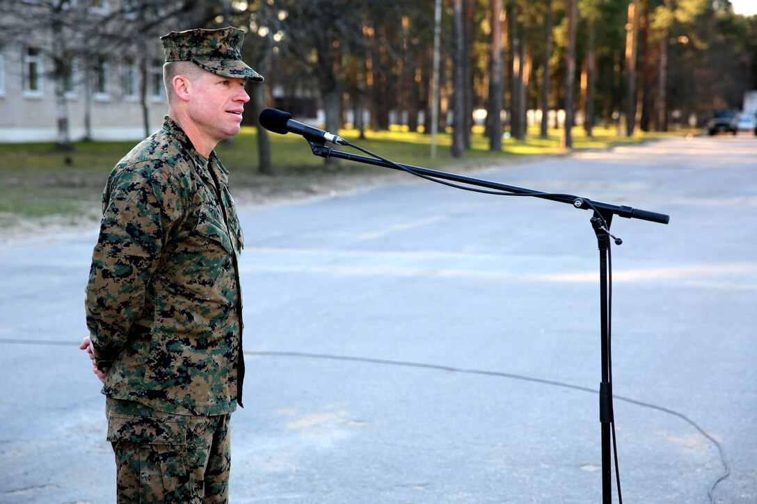 U.S. Marine Lt. Col. Trevor Hall, the battalion commander of Black Sea Rotational Force 14 from 3rd Battalion, 8th Marine Regiment, 2nd Marine Division, addresses U.S., Latvian and Estonian service members during the closing ceremony for exercise Summer Shield aboard Camp Adazi, Latvia, April 16, 2014. This is the 11th iteration of the Summer Shield exercise, a joint staff planning and live-fire maneuver event designed to enhance the NATO force’s capacity and capability to integrate combined arms and maneuver at the battalion and brigade level. It also increases partner capacity, promotes regional stability, and enhances Latvian, Lithuanian, Estonian, and U.S. interoperability as NATO allies. (Official Marine Corps photo by Lance Cpl. Scott W. Whiting, BSRF PAO/ Released)